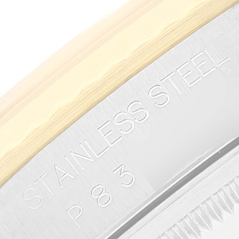 This image shows a close-up of the case back of a Rolex Datejust 16233 Men
s Steel and Gold (two tone) Grey Dial 16233 Men
s Steel and Gold (two tone) Grey Dial watch, highlighting the "STAINLESS STEEL" engraving.