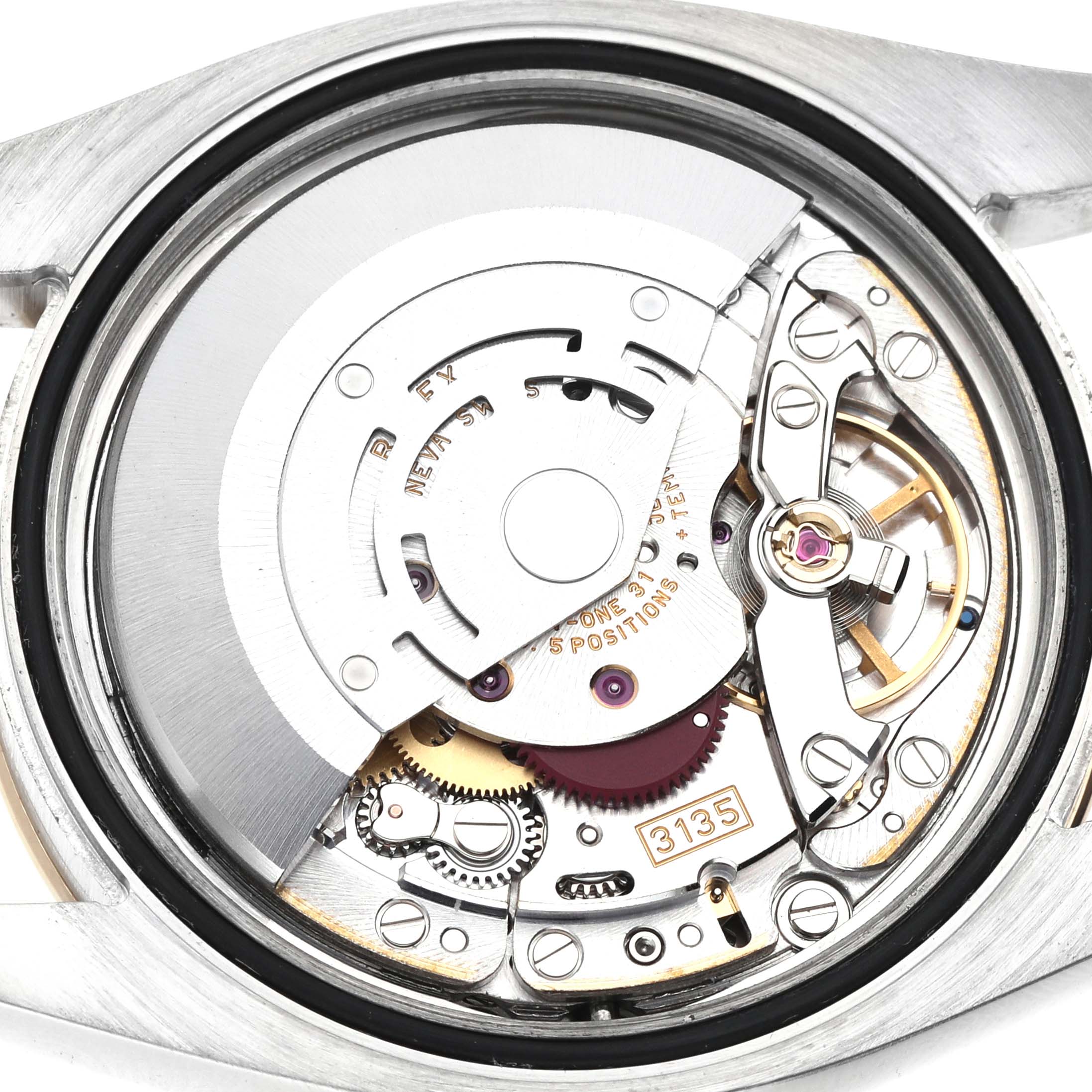 The image shows the movement of a Rolex Datejust 116263 Men's Steel and Gold (two tone) White Dial watch, viewed from the back, highlighting gears and components.
