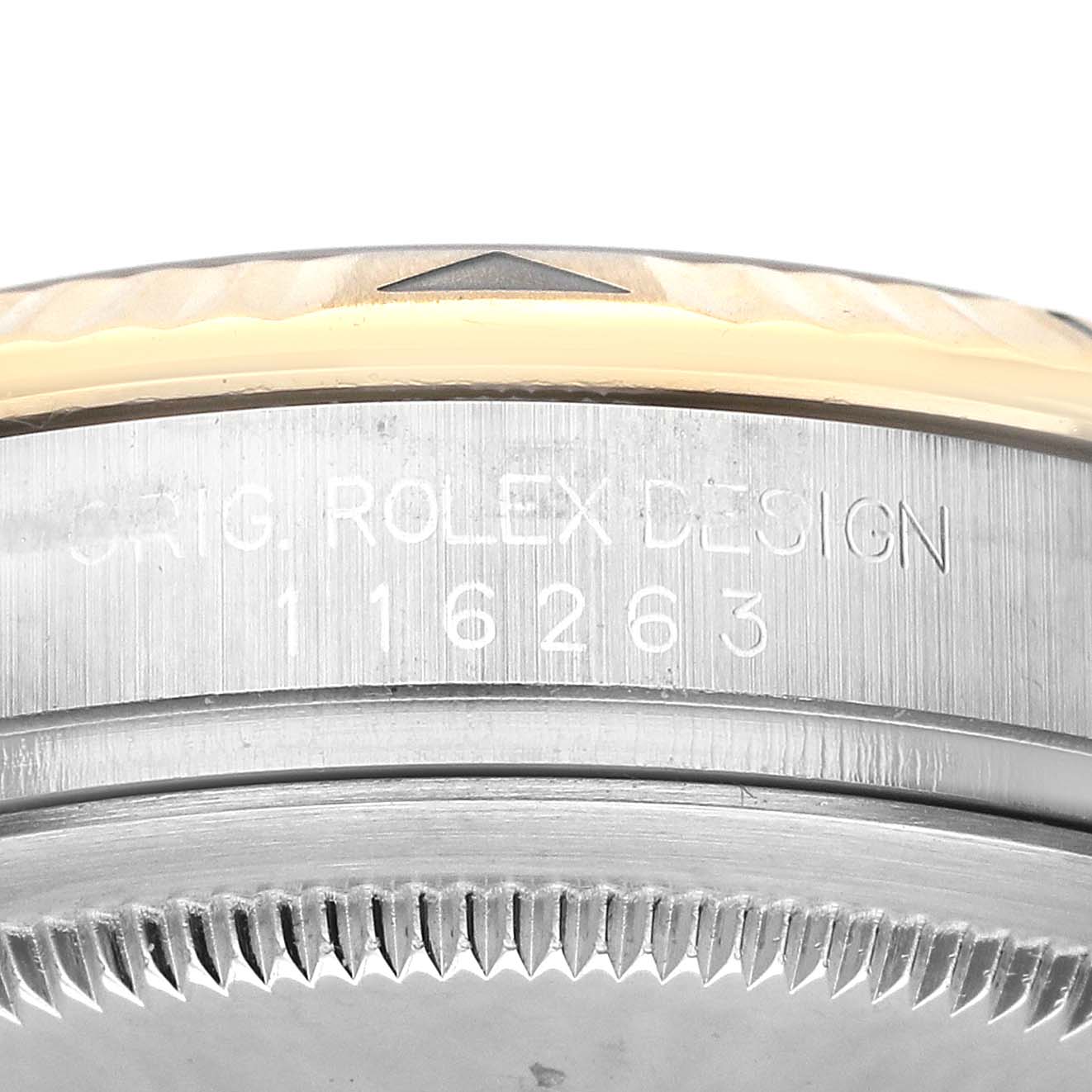 The image shows the side of a Rolex Datejust 116263 Men's Steel and Gold (two tone) White Dial, featuring engraved serial numbers and partial view of the bezel and case.