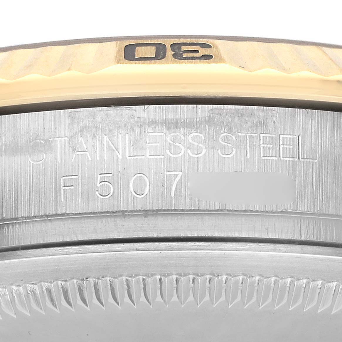 The image shows a close-up of the bezel and case edge of a Rolex Datejust 116263 Men's Steel and Gold (two tone) White Dial, highlighting engraved text and the number "30."