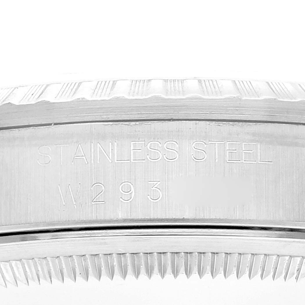 Close-up of the Rolex Datejust 16220 Men's Stainless Steel White Dial 16220 Men's Stainless Steel White Dial watch case, showing the "STAINLESS STEEL" engraving and a partial serial number.