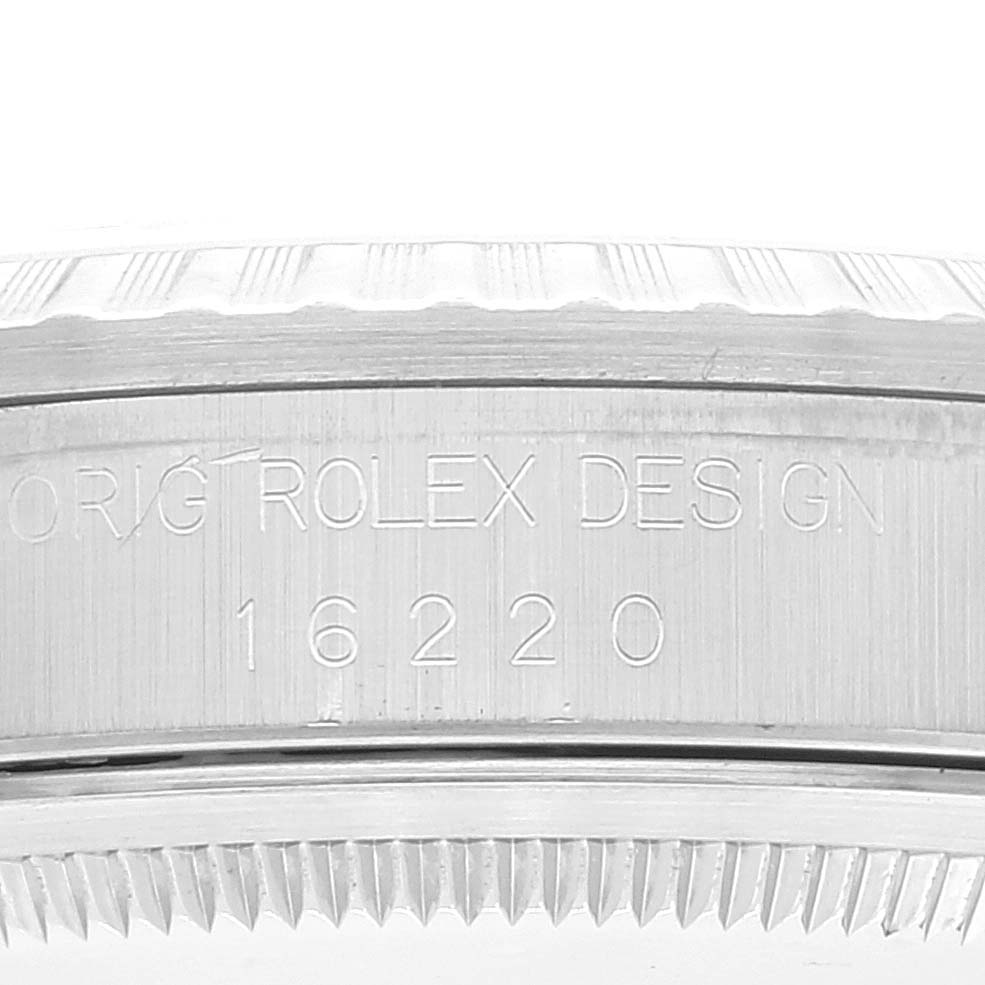 The image shows a close-up of the side of a Rolex Datejust 16220 Men's Stainless Steel White Dial 16220 Men's Stainless Steel White Dial model 16220, highlighting the engraved design number.