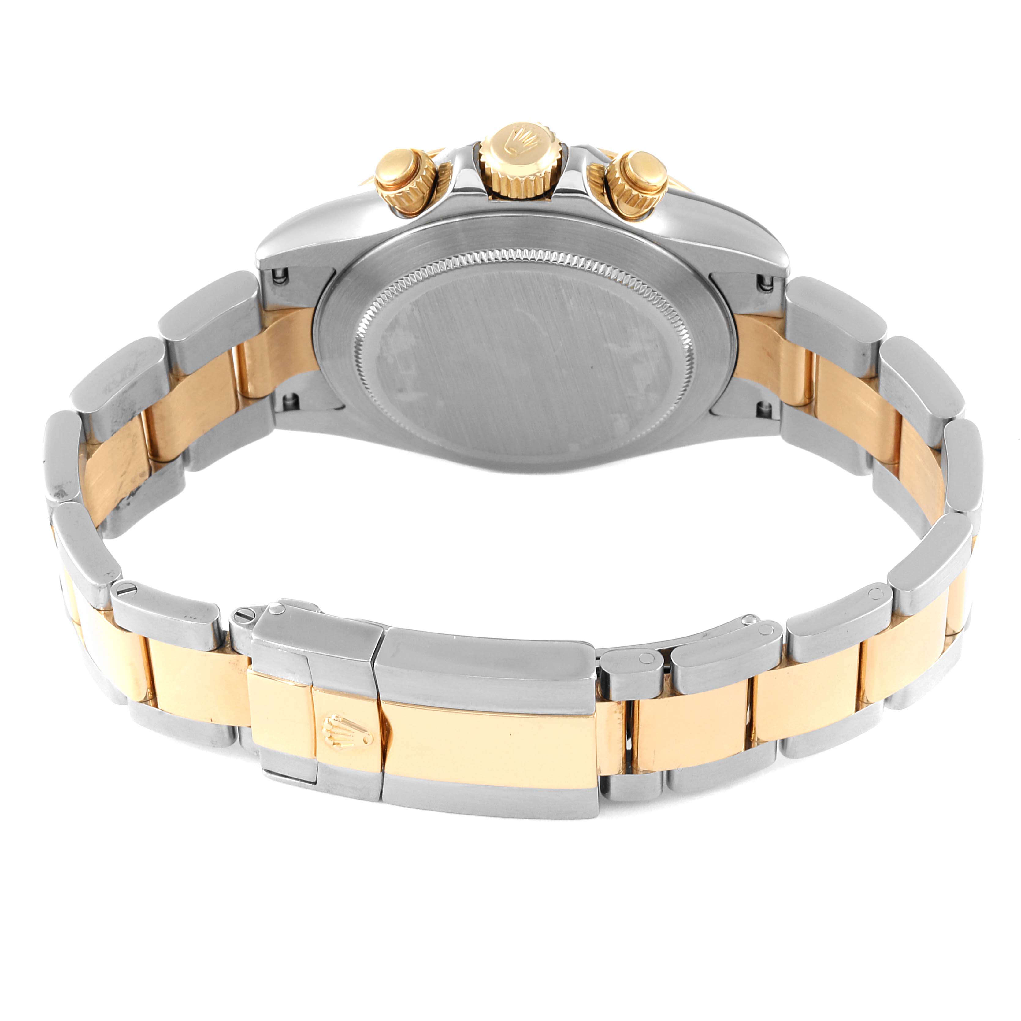 The image shows the back view of a Rolex Daytona 116523 Men's Steel and Gold (two tone) Black Dial 116523 Men's Steel and Gold (two tone) Black Dial watch, highlighting its two-tone bracelet, case back, and crown.