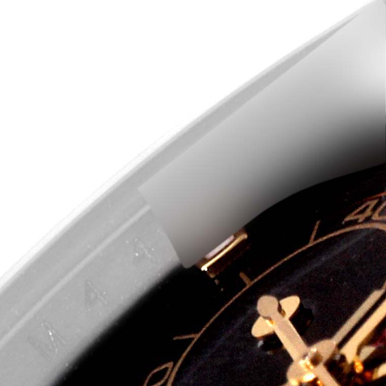 The image shows a close-up of the dial and bezel of a Rolex Daytona 116523 Men's Steel and Gold (two tone) Black Dial 116523 Men's Steel and Gold (two tone) Black Dial watch at an angled view.