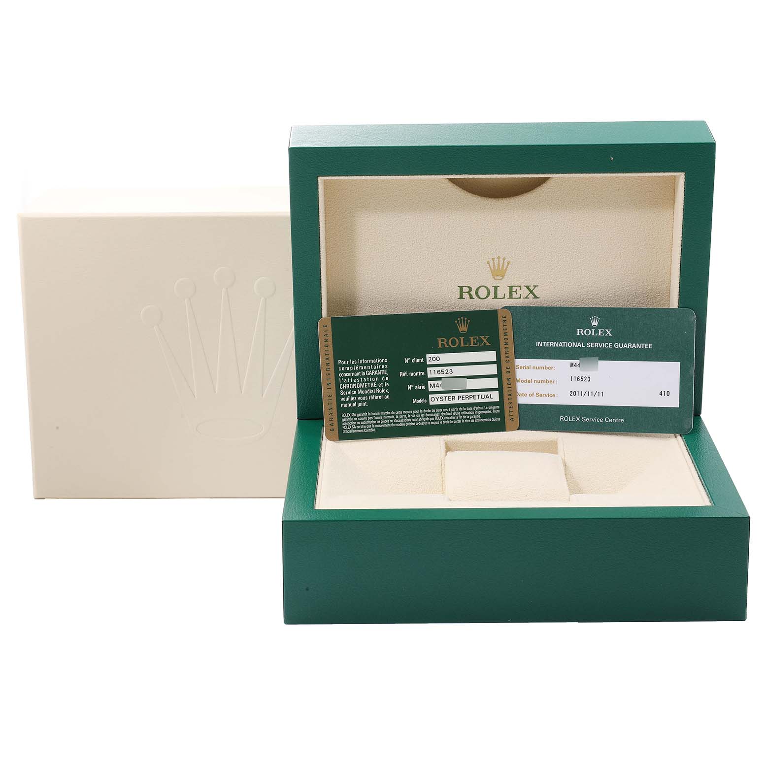 The image shows the green and beige box and warranty card for the Rolex Daytona 116523 Men's Steel and Gold (two tone) Black Dial 116523 Men's Steel and Gold (two tone) Black Dial watch model.