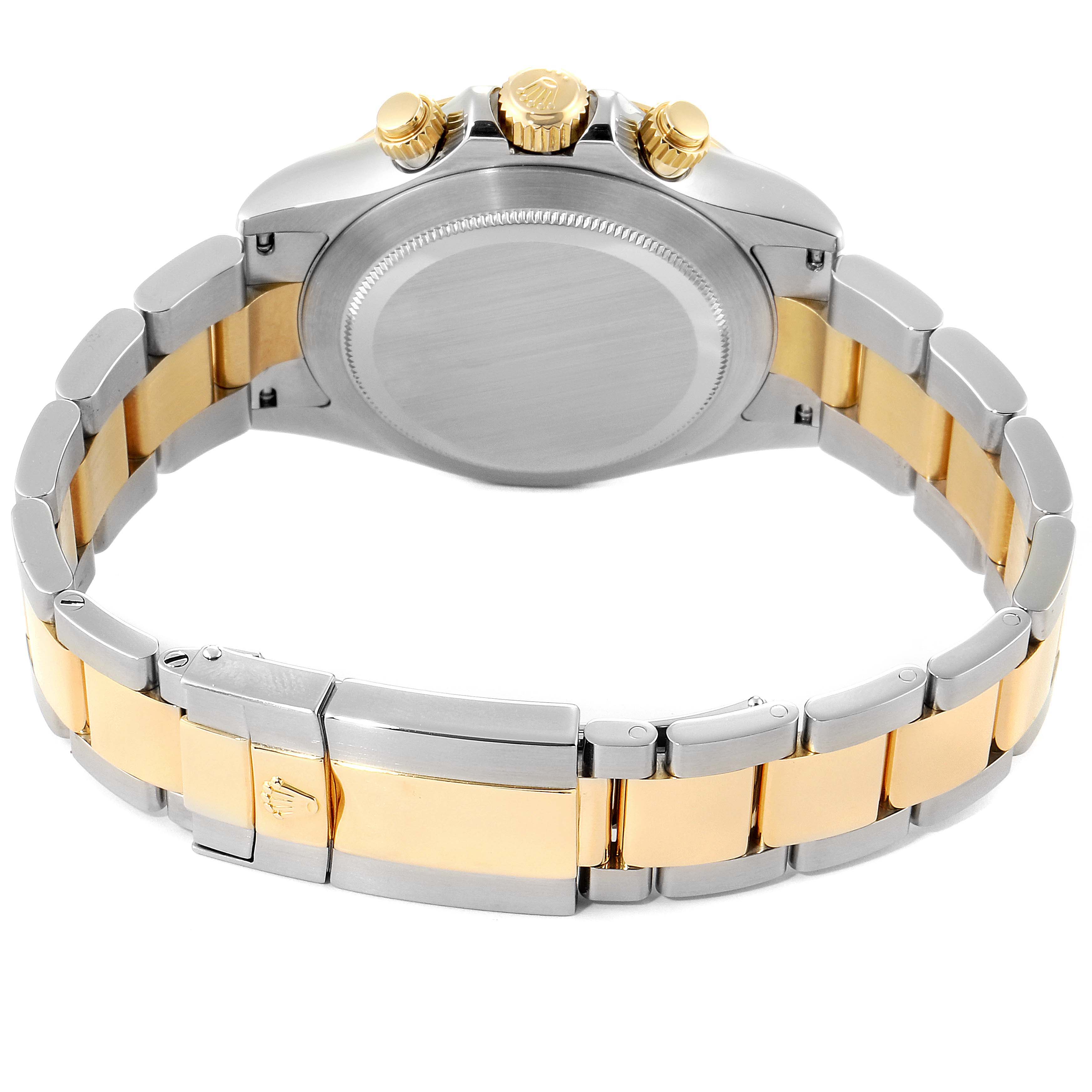 This image shows the back and bracelet of a Rolex Daytona 116523 Men's Steel and Gold (two tone) White Dial 116523 Men's Steel and Gold (two tone) White Dial watch, highlighting the clasp, crown, and two-tone bracelet.