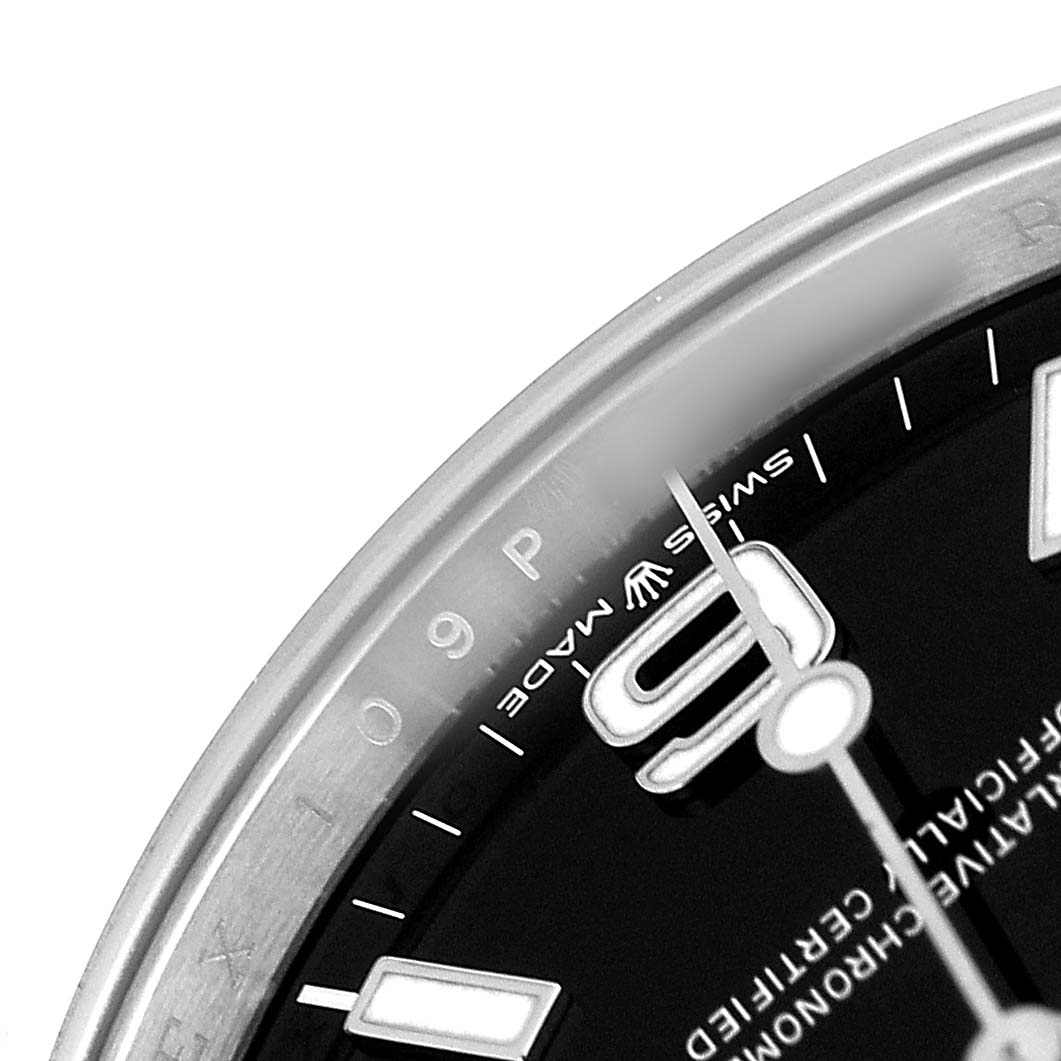 The image shows a close-up of the Rolex Explorer 224270 Men's Stainless Steel Black Dial's dial, highlighting the hour markers and part of the bezel edge.