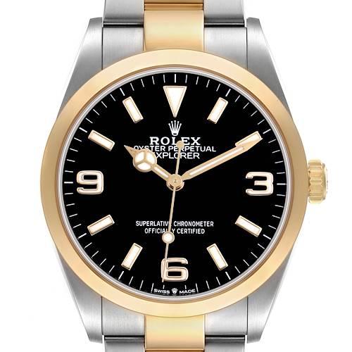 The Rolex Explorer 124273 Men's Steel and Gold (two tone) Black Dial watch is shown from the front, highlighting its black dial, gold bezel, and two-tone bracelet.
