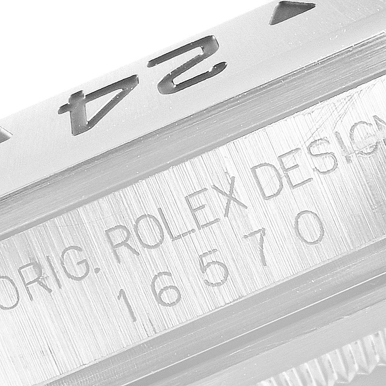 The close-up angle of this Rolex Explorer 16570 Men's Stainless Steel Black Dial 16570 Men's Stainless Steel Black Dial model shows the bezel edge and the engraved serial number on the case.