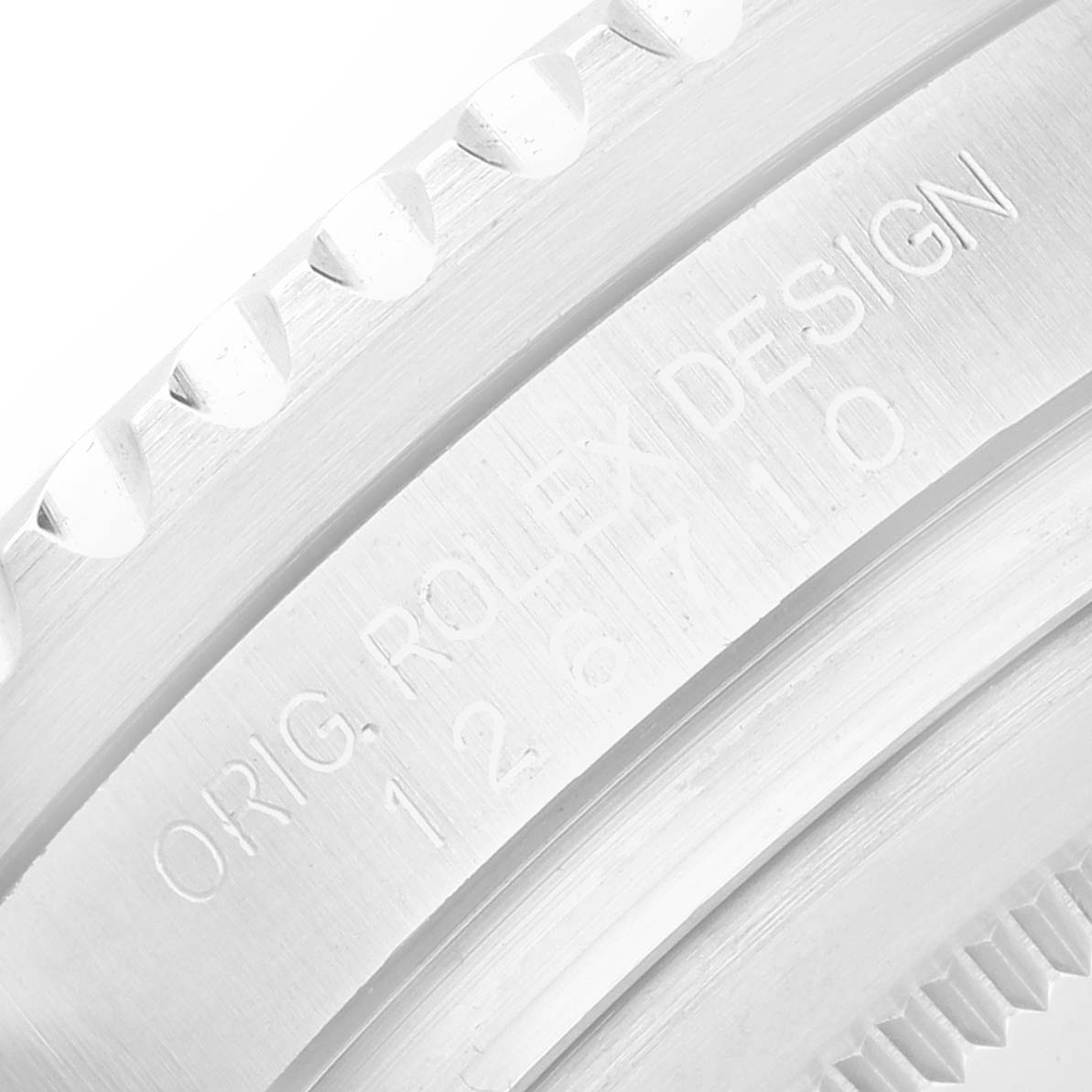 The image shows a close-up of the engraved side of the bezel on a Rolex GMT-Master 126710 Men's Stainless Steel Black Dial, highlighting the text "ORIG. ROLEX DESIGN".