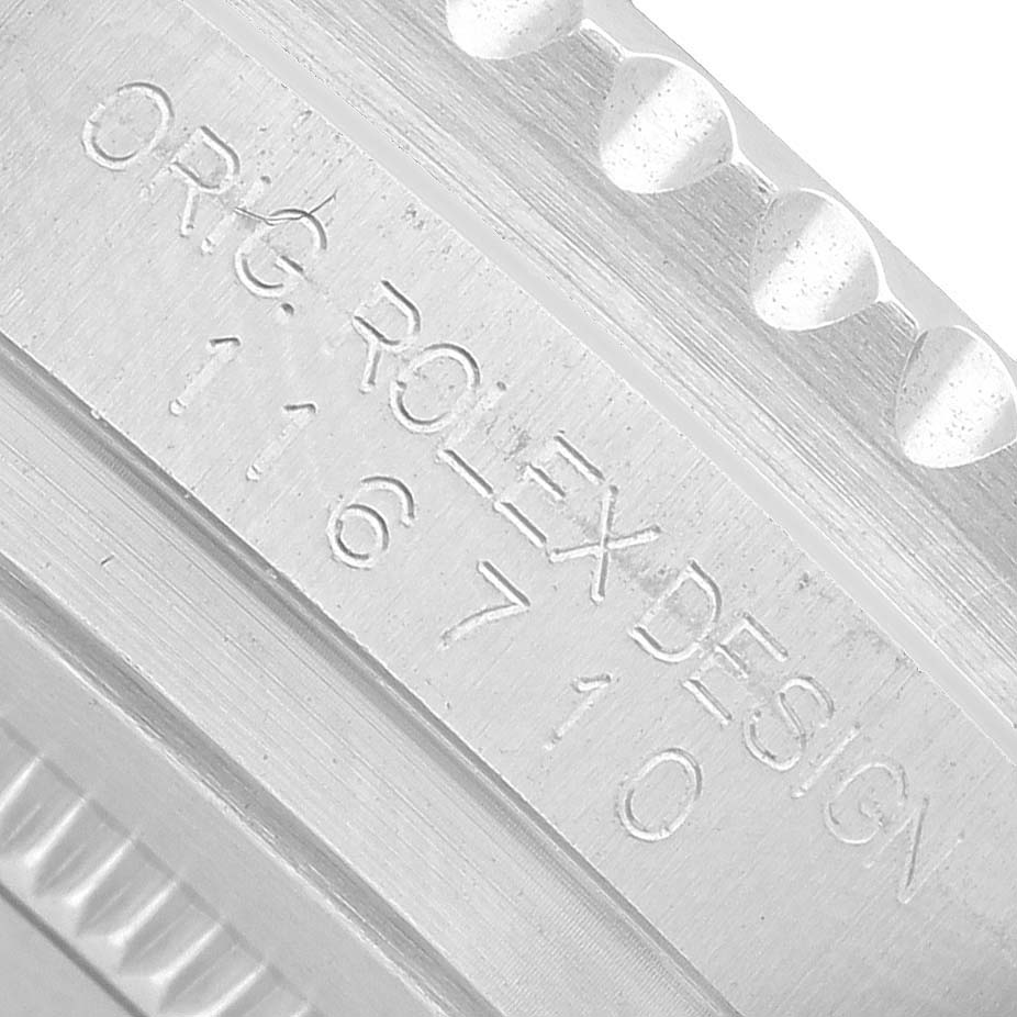 The image shows a close-up of the side engraving with the model number on the Rolex GMT-Master 116710BLNR Men's Stainless Steel Black Dial.