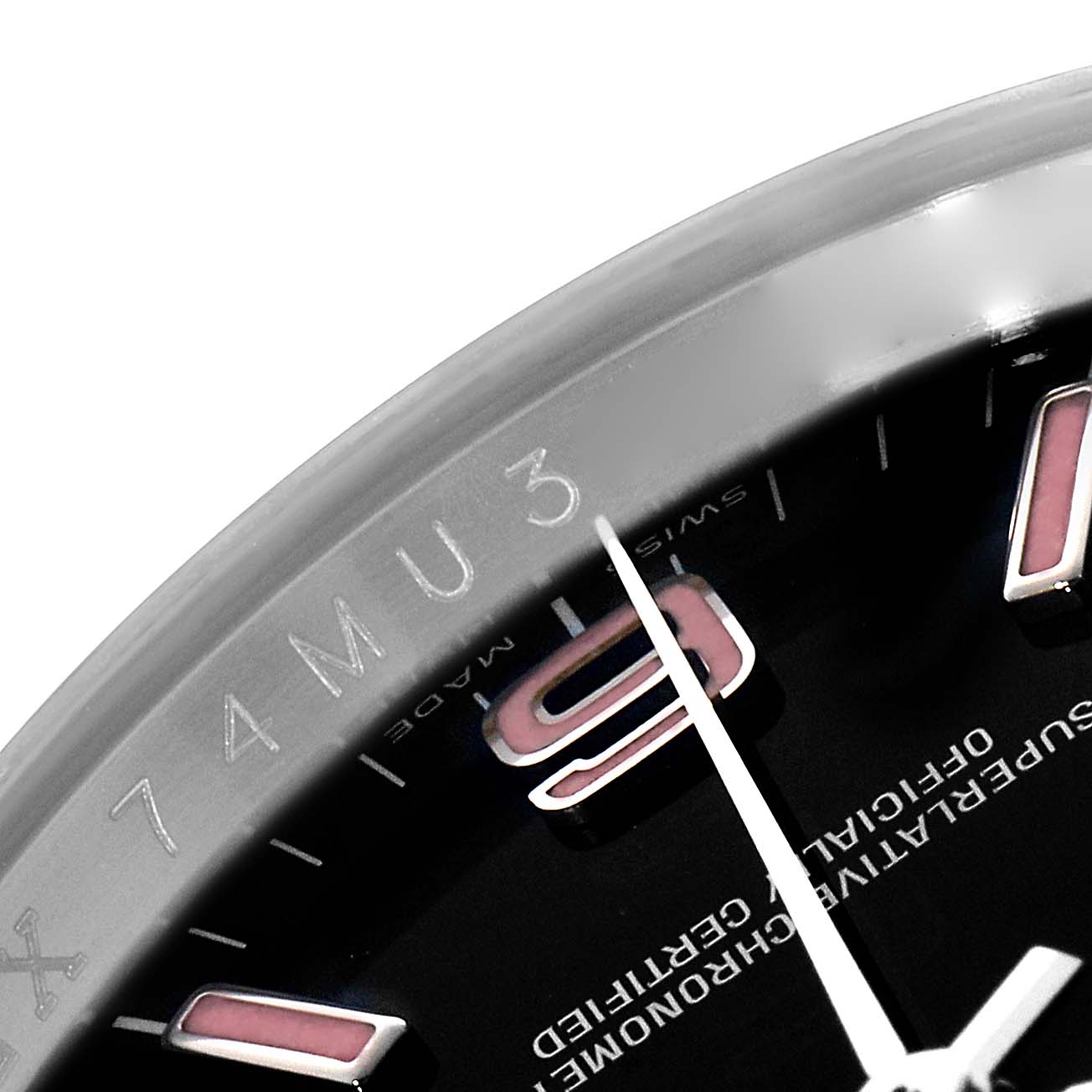 The image shows a close-up of the Rolex Oyster Perpetual 116000 Men's Stainless Steel Black Dial watch, focusing on the dial, bezel, and a glimpse of the hour markers.