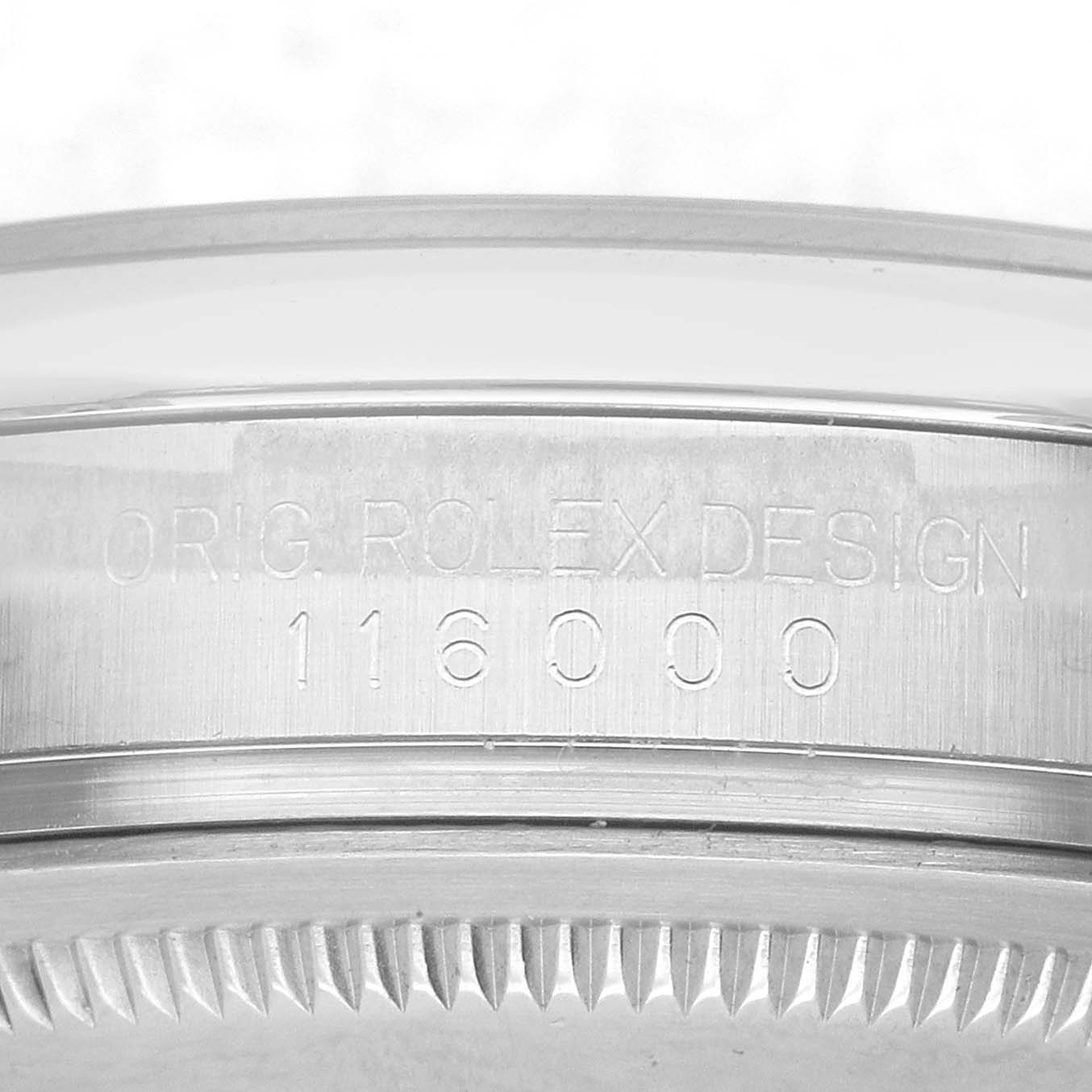 The image shows the side view of the Rolex Oyster Perpetual 116000 Men's Stainless Steel Black Dial case, featuring engraved details.