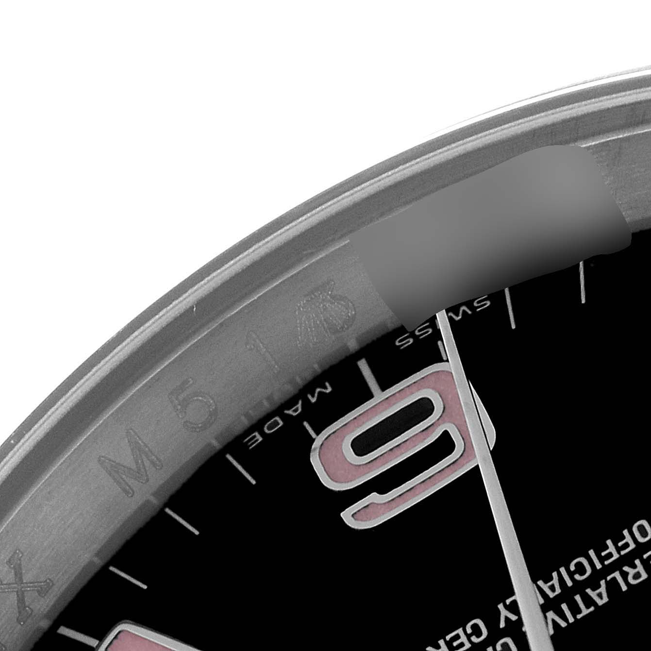 The image shows a close-up of the bezel, part of the dial, and the hour hand of the Rolex Oyster Perpetual 116000 Men's Stainless Steel Black Dial 116000 Men's Stainless Steel Black Dial watch.