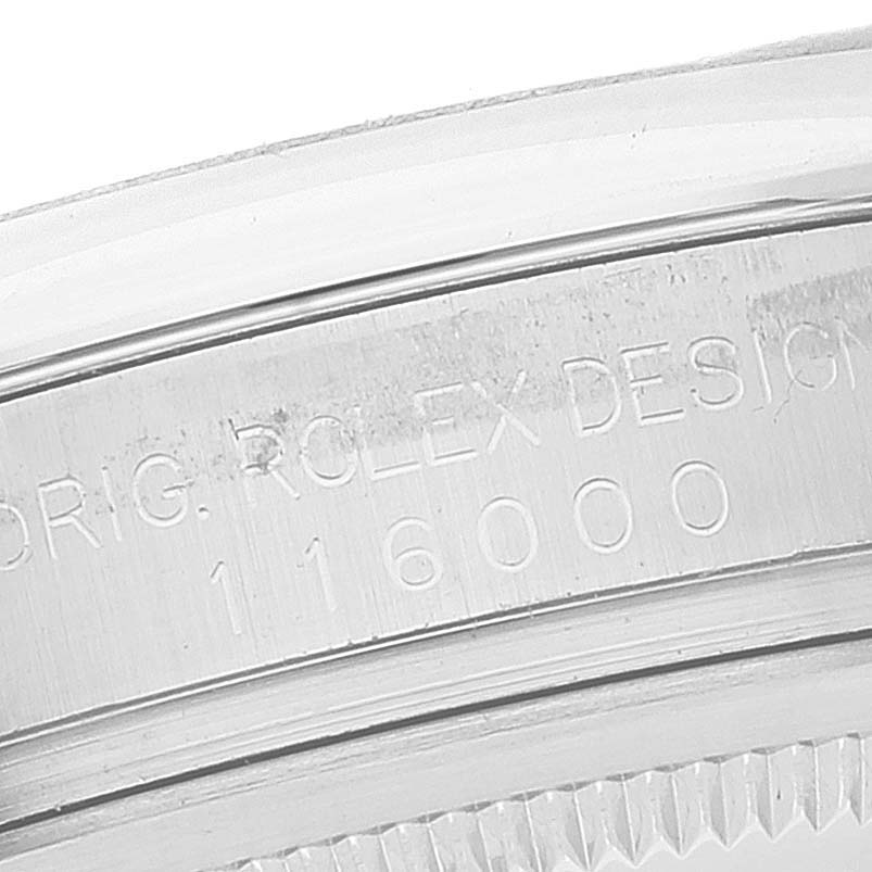This image shows a close-up of the engraved bezel and edge of the Rolex Oyster Perpetual 116000 Men's Stainless Steel Black Dial 116000 Men's Stainless Steel Black Dial model watch.