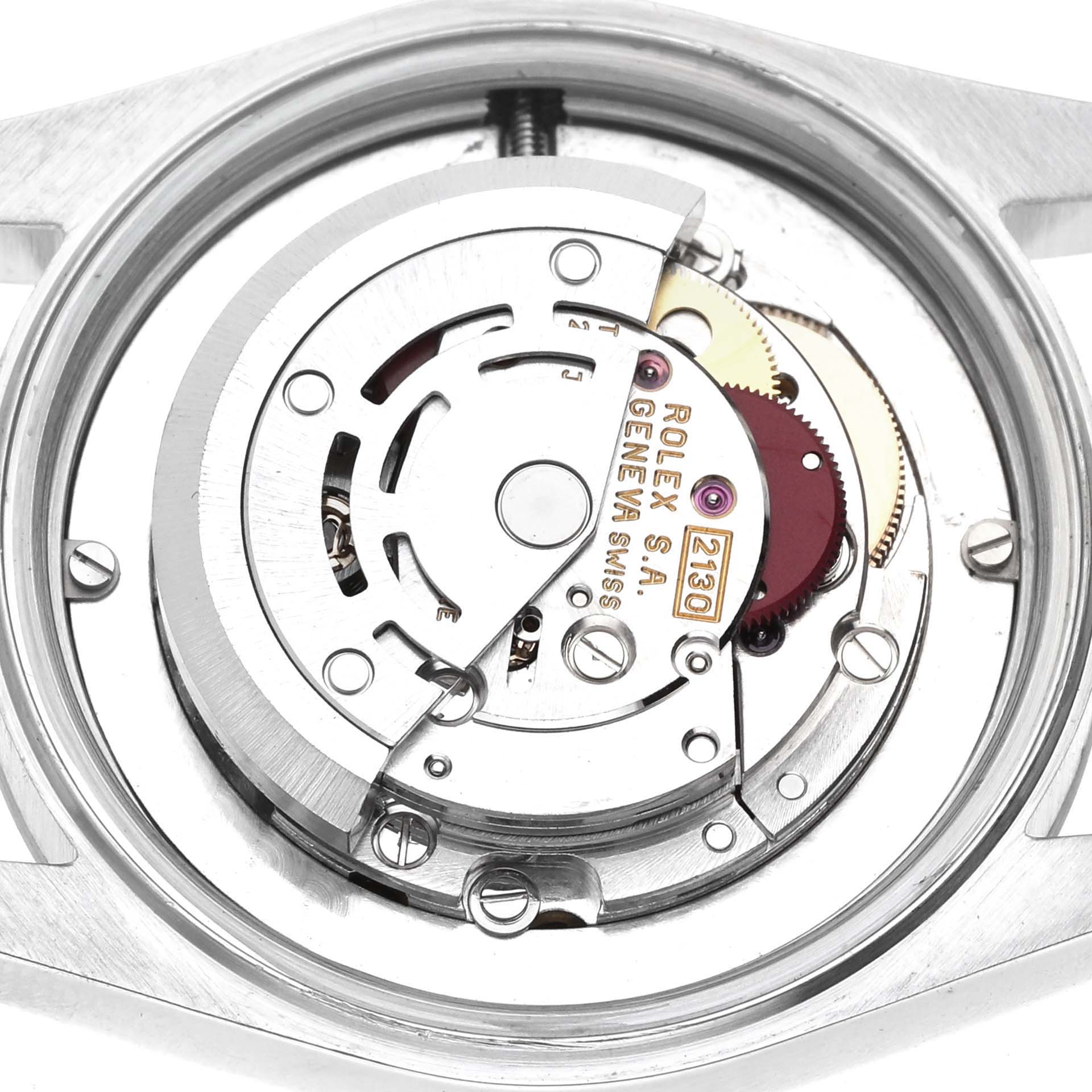 The image shows a close-up of the Rolex Oyster Perpetual 67480 Women's Stainless Steel White Dial watch movement, highlighting gears and components from the back.
