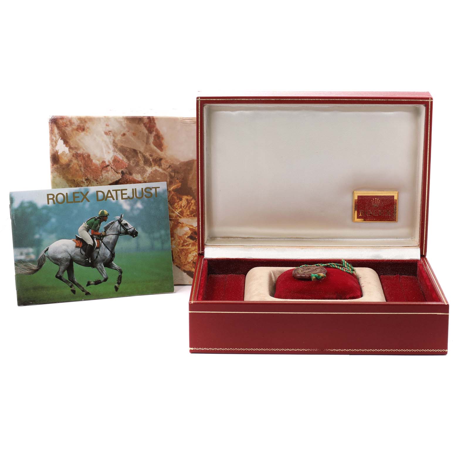 The image shows the packaging and accessories for a Rolex President 68288 Women's Yellow Gold Champagne Dial 68288 Women's Yellow Gold Champagne Dial model watch, including the box, cushion, and a booklet.