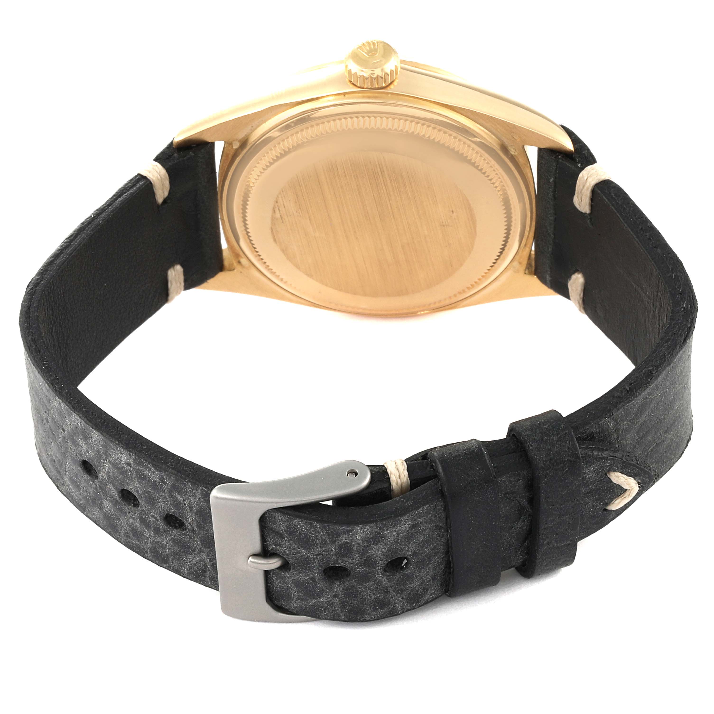 This image shows the back case and the leather strap of a Rolex President 1803 Men's Yellow Gold Champagne Dial 1803 Men's Yellow Gold Champagne Dial model watch.