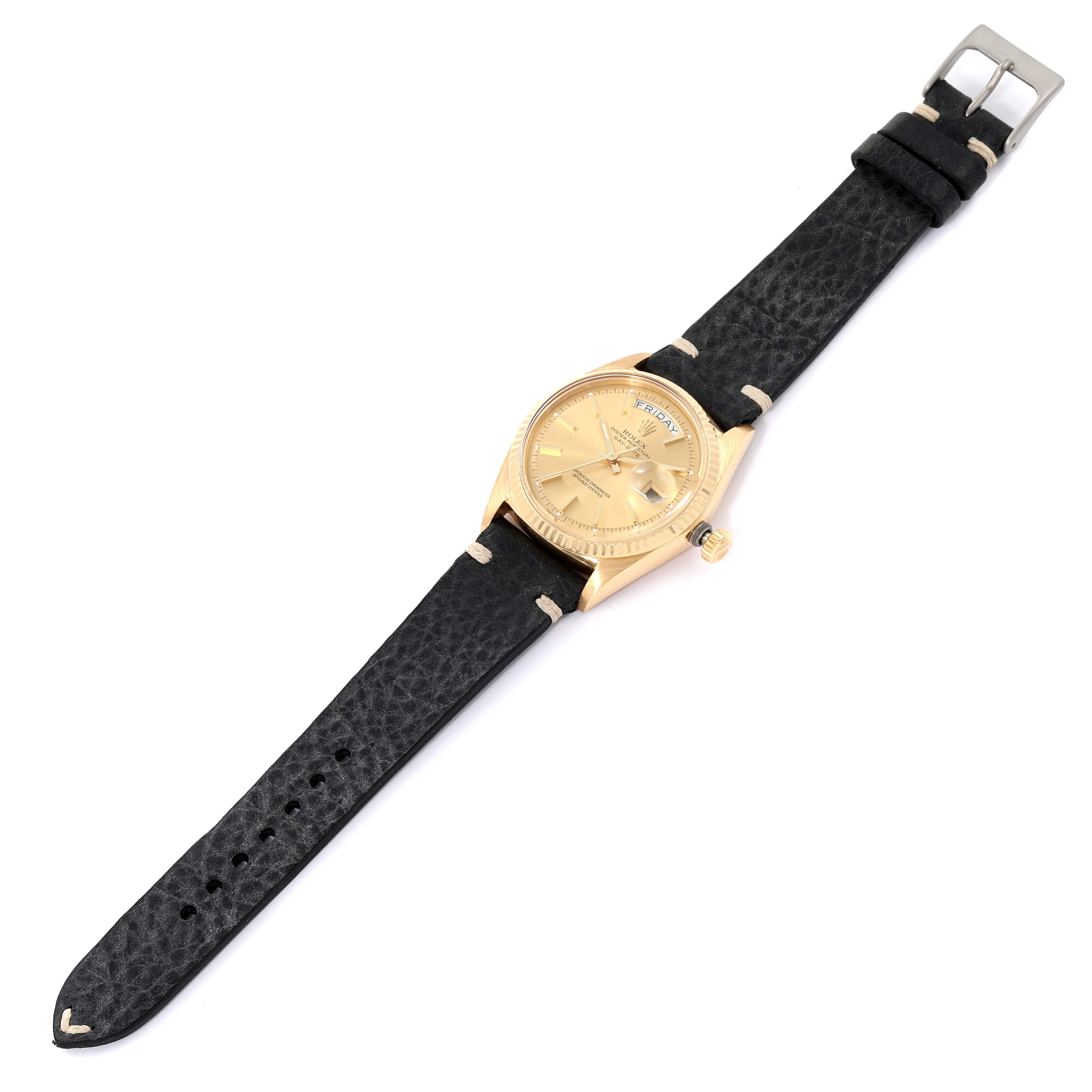 The image shows a Rolex President 1803 Men's Yellow Gold Champagne Dial 1803 Men's Yellow Gold Champagne Dial model watch from a top view, featuring a gold case and a black leather strap.