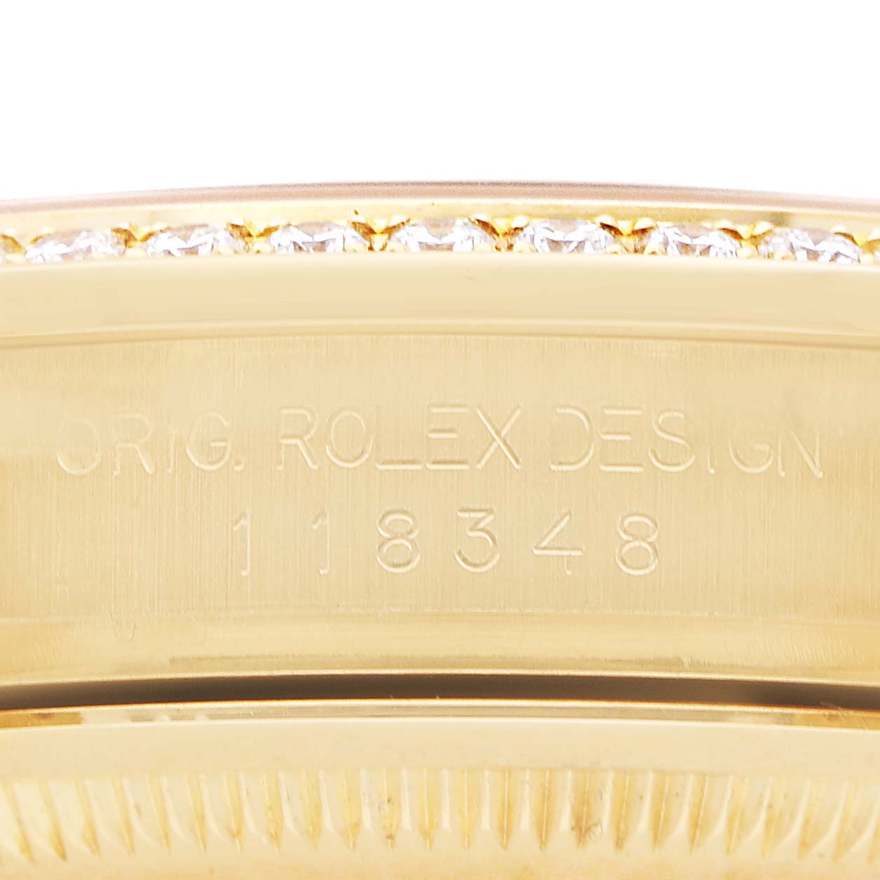 The image shows the engraved side of a Rolex President 118348 Men's Yellow Gold Champagne Dial model, highlighting the design and serial number.