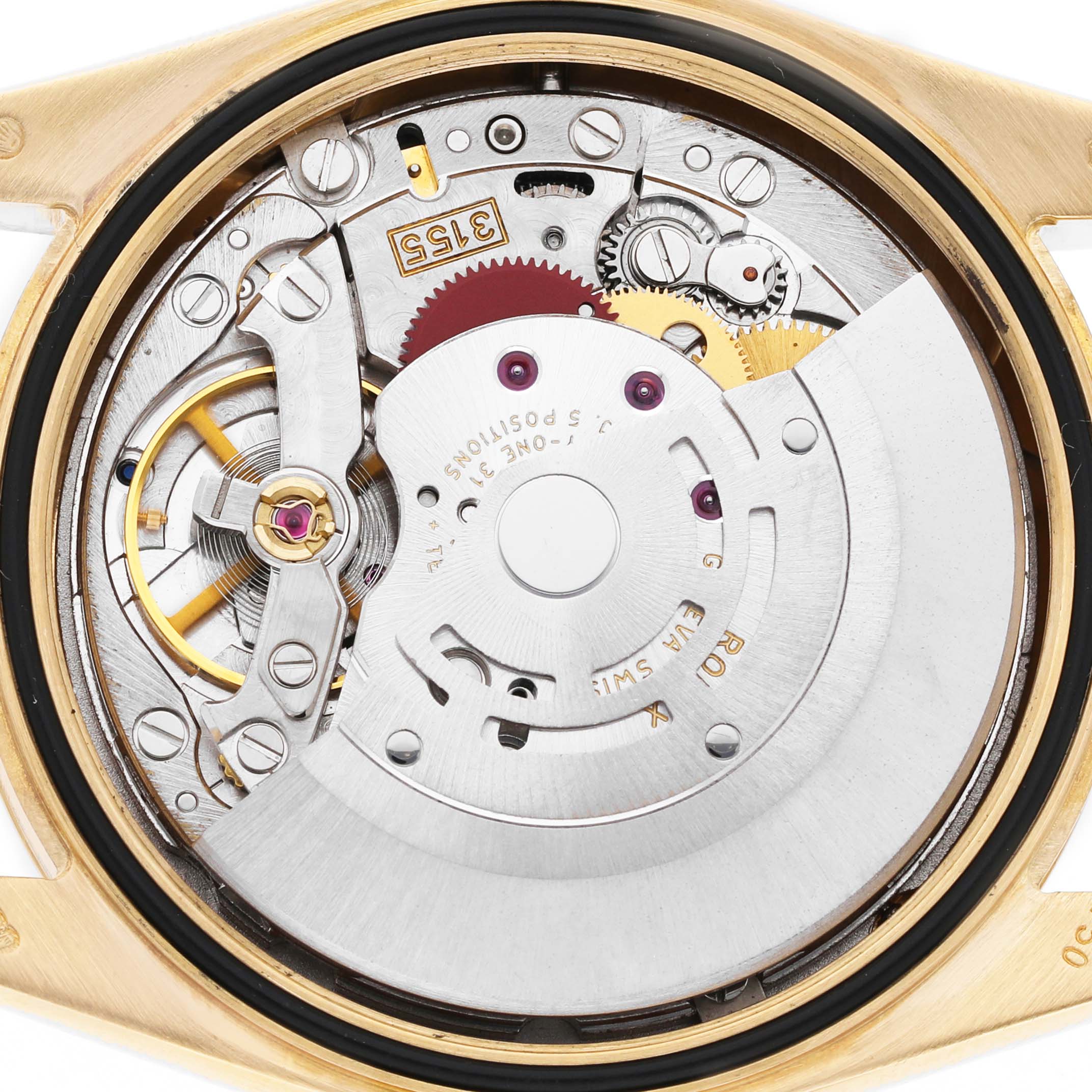 The image shows the movement of a Rolex President 118238 Men's Yellow Gold Champagne Dial watch, viewed from the back, revealing intricate gears and components.