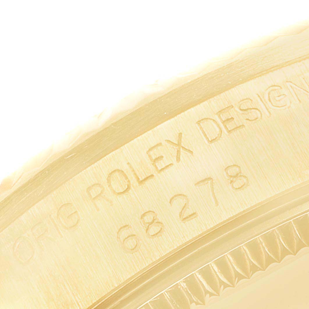 The image shows a close-up of the side of a Rolex President 68278 Women's Yellow Gold Champagne Dial model, focusing on the engraved bezel details.