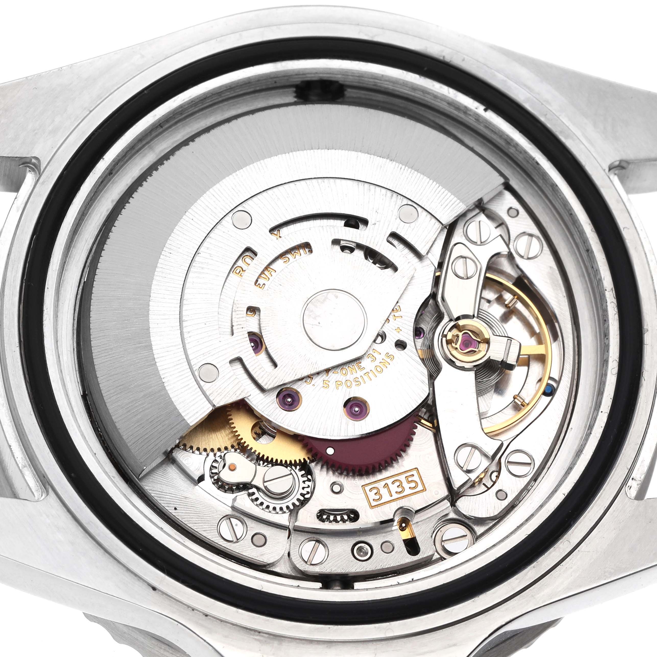 The image shows a detailed view of the movement inside a Rolex Sea-Dweller 16600 Men's Stainless Steel Black Dial watch, highlighting gears and the rotor mechanism.