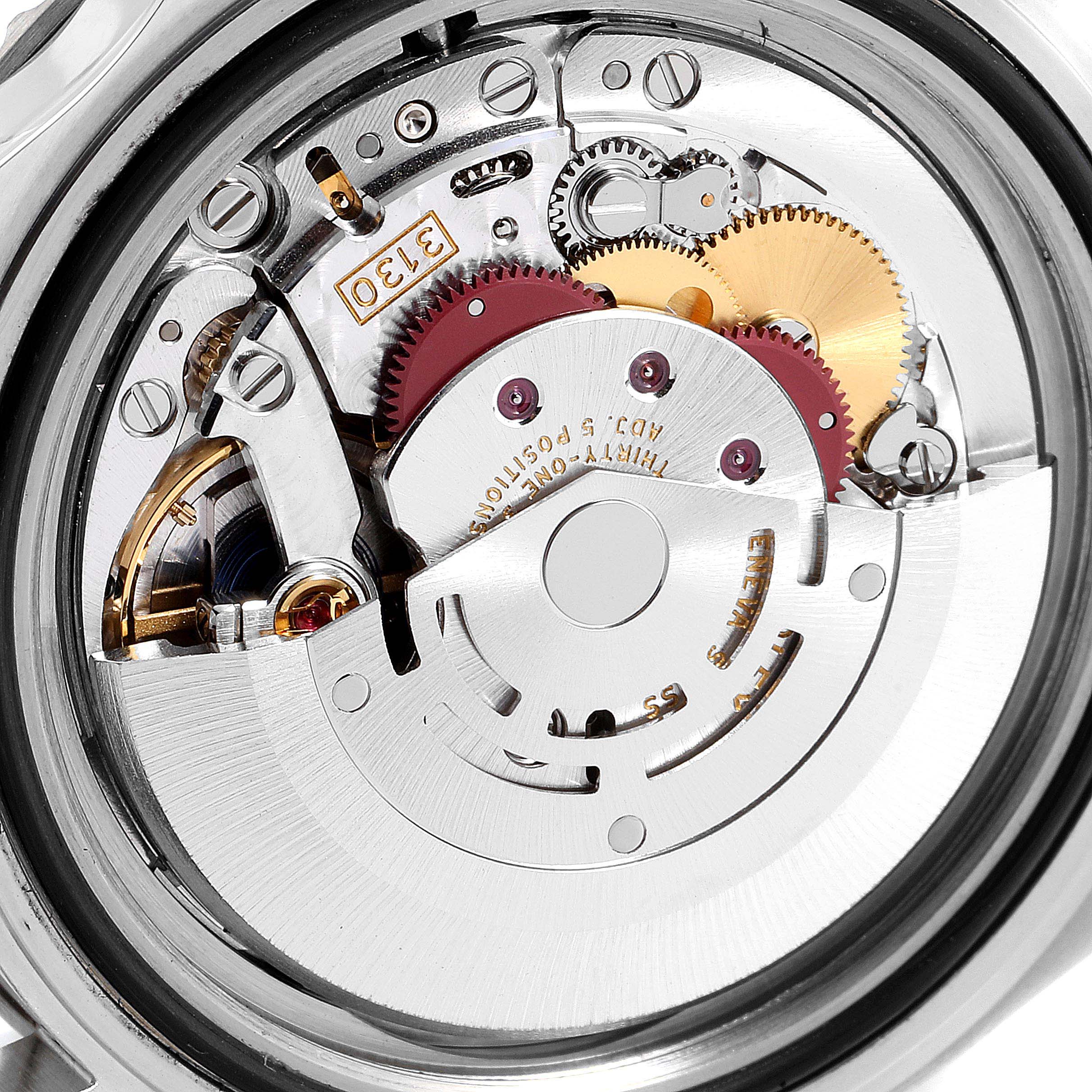 This image shows a close-up of the internal mechanical movement parts of a Rolex Submariner 14060 Men's Stainless Steel Black Dial 14060 Men's Stainless Steel Black Dial watch.