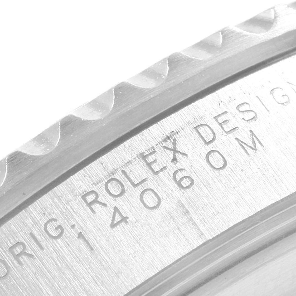 This close-up image shows the side engraving details on the bezel of a Rolex Submariner 14060 Men's Stainless Steel Black Dial 14060 Men's Stainless Steel Black Dial watch.