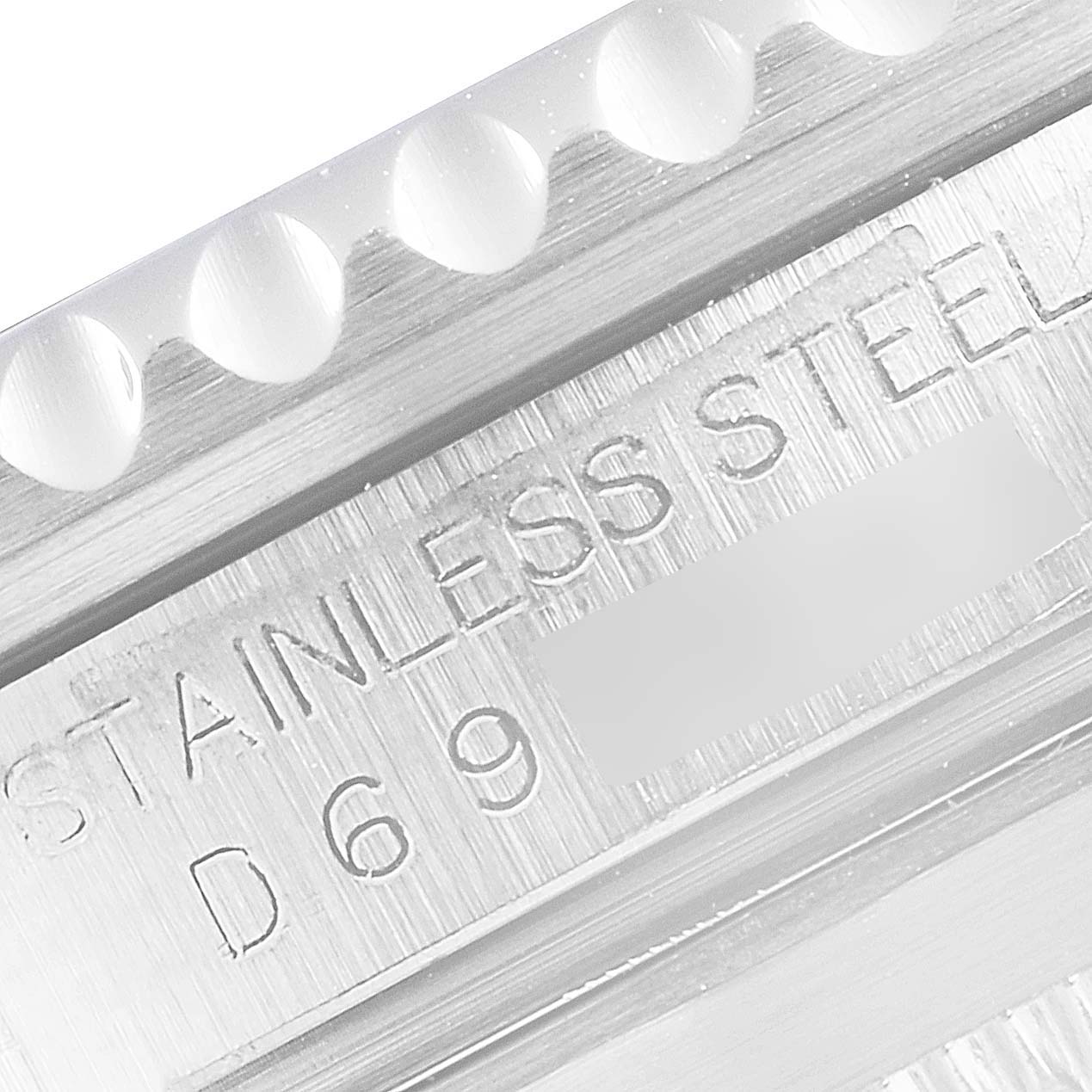 This close-up image shows the engraved text and part of the bezel of a Rolex Submariner 16610LV Men
s Stainless Steel Black Dial 16610LV Men
s Stainless Steel Black Dial watch.