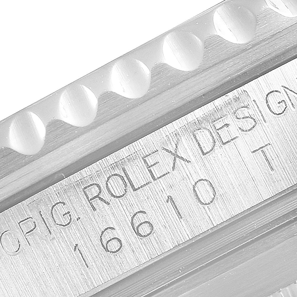 This close-up shows the model number and serial engraving on the Rolex Submariner 16610LV Men
s Stainless Steel Black Dial 16610LV Men
s Stainless Steel Black Dial
s watch case.