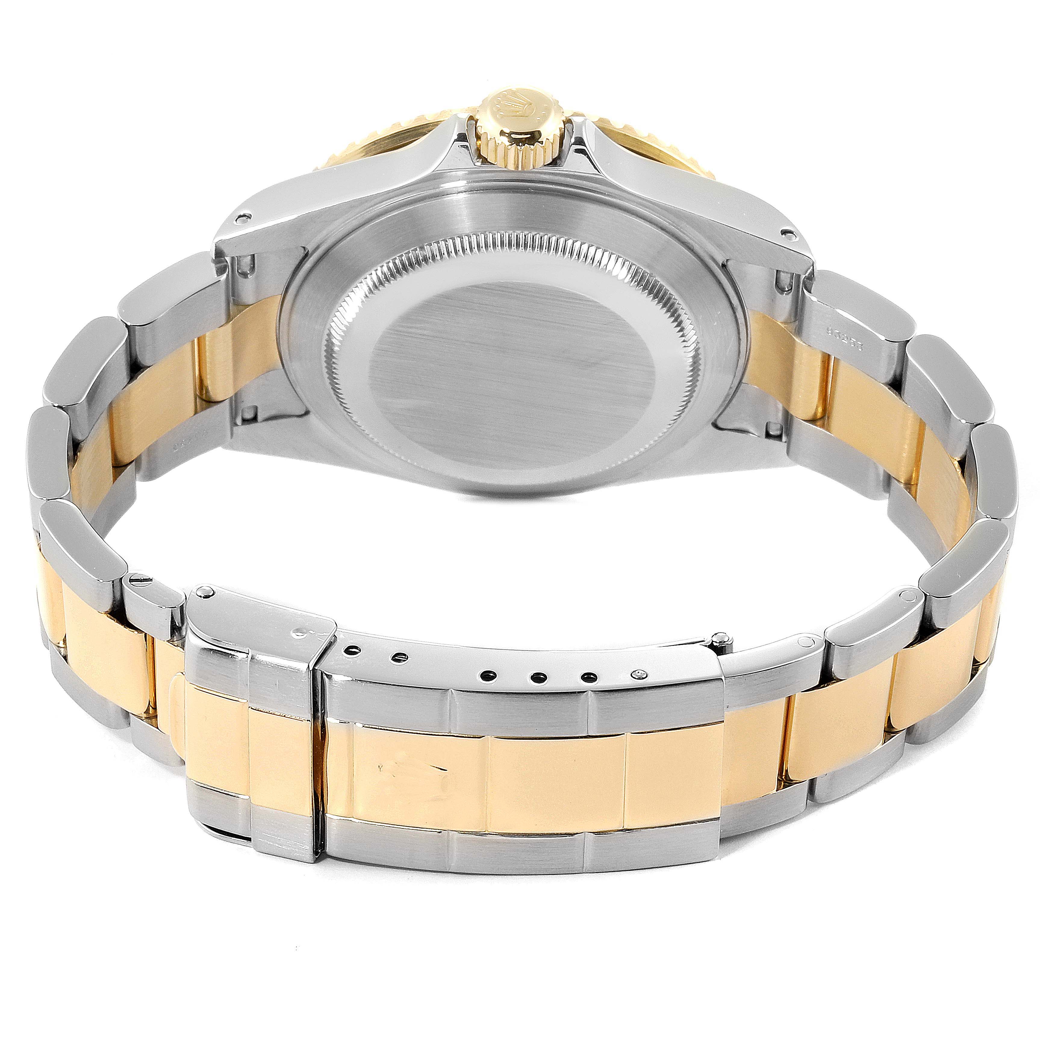 The image shows the back case and bracelet of a Rolex Submariner 16613 Men
s Steel and Gold (two tone) Black Dial 16613 Men
s Steel and Gold (two tone) Black Dial watch, highlighting its two-tone metal design.