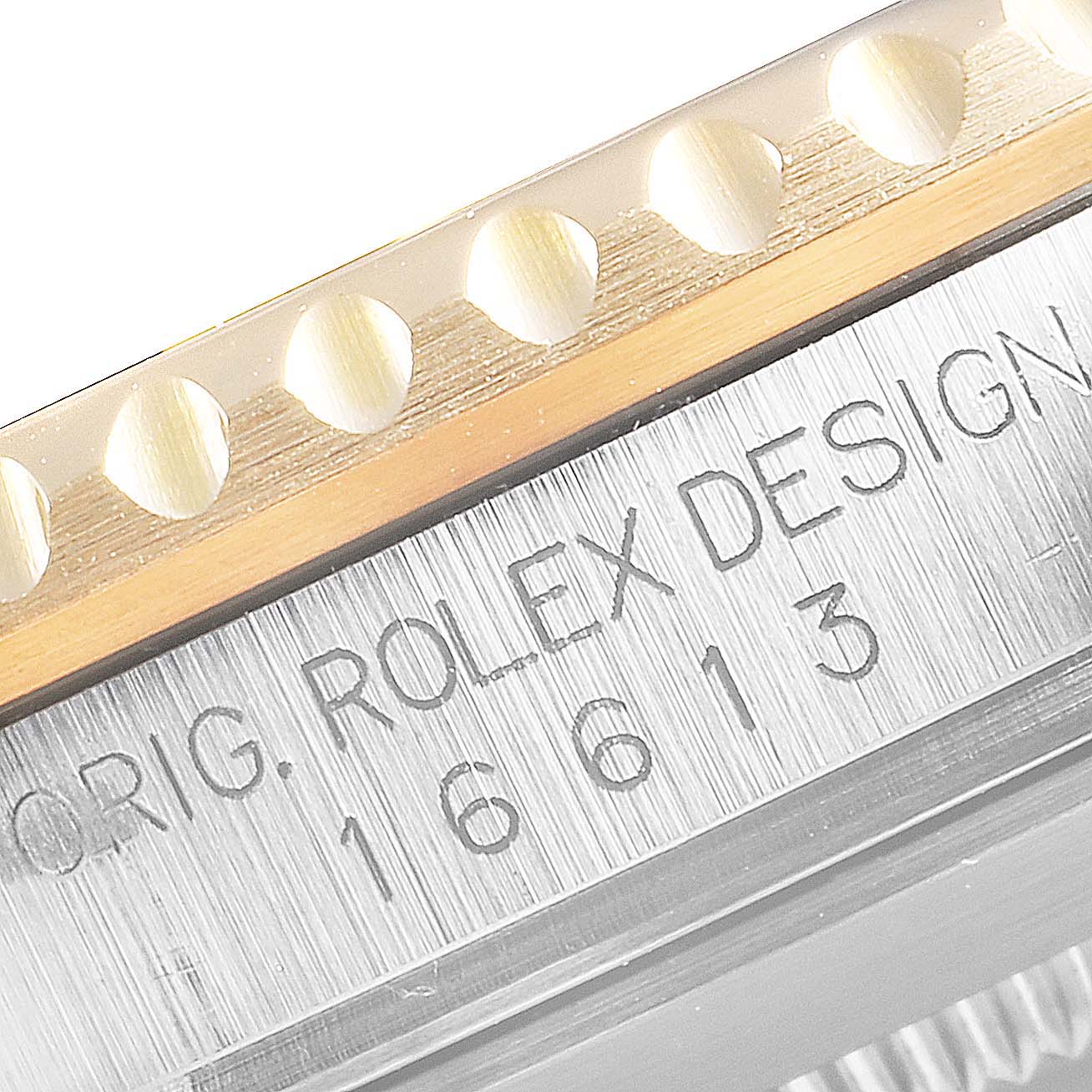 This image shows a close-up of the bezel and the case side of a Rolex Submariner 16613 Men
s Steel and Gold (two tone) Black Dial 16613 Men
s Steel and Gold (two tone) Black Dial, model number 16613.