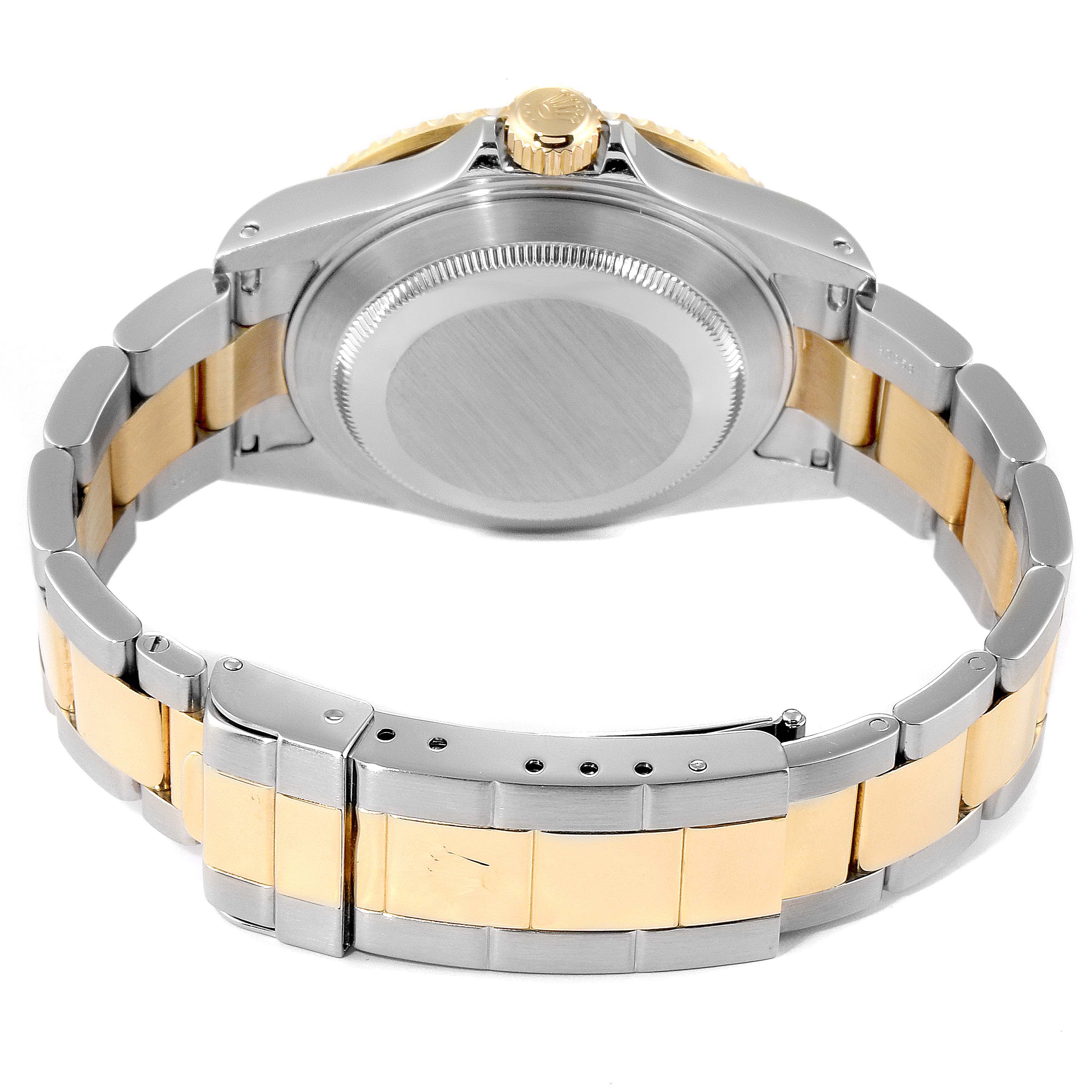 This image shows the back case and bracelet of a Rolex Submariner 16613 Men
s Steel and Gold (two tone) Black Dial 16613 Men
s Steel and Gold (two tone) Black Dial watch from a rear angle.