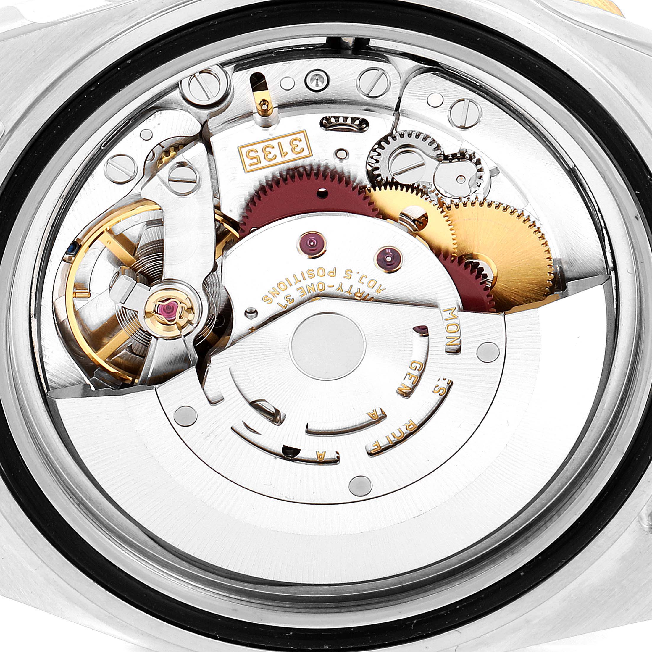 This image shows the inner mechanical movement of a Rolex Submariner 16613 Men's Steel and Gold (two tone) Blue Dial 16613 Men's Steel and Gold (two tone) Blue Dial watch from a back view.