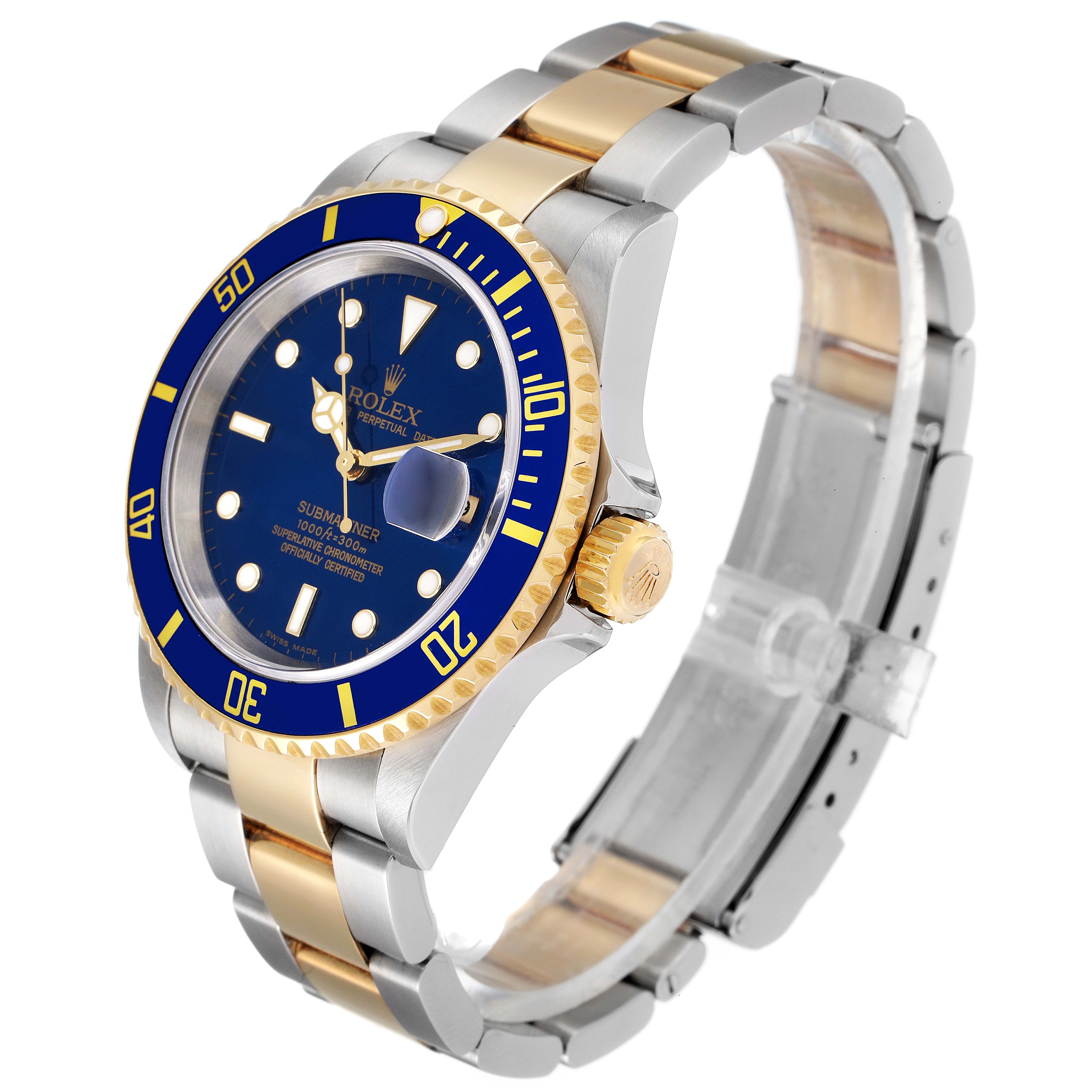 The Rolex Submariner 16613 Men
s Steel and Gold (two tone) Blue Dial 16613 Men
s Steel and Gold (two tone) Blue Dial watch is shown at a three-quarter angle, highlighting its blue dial, gold bezel, and two-tone bracelet.