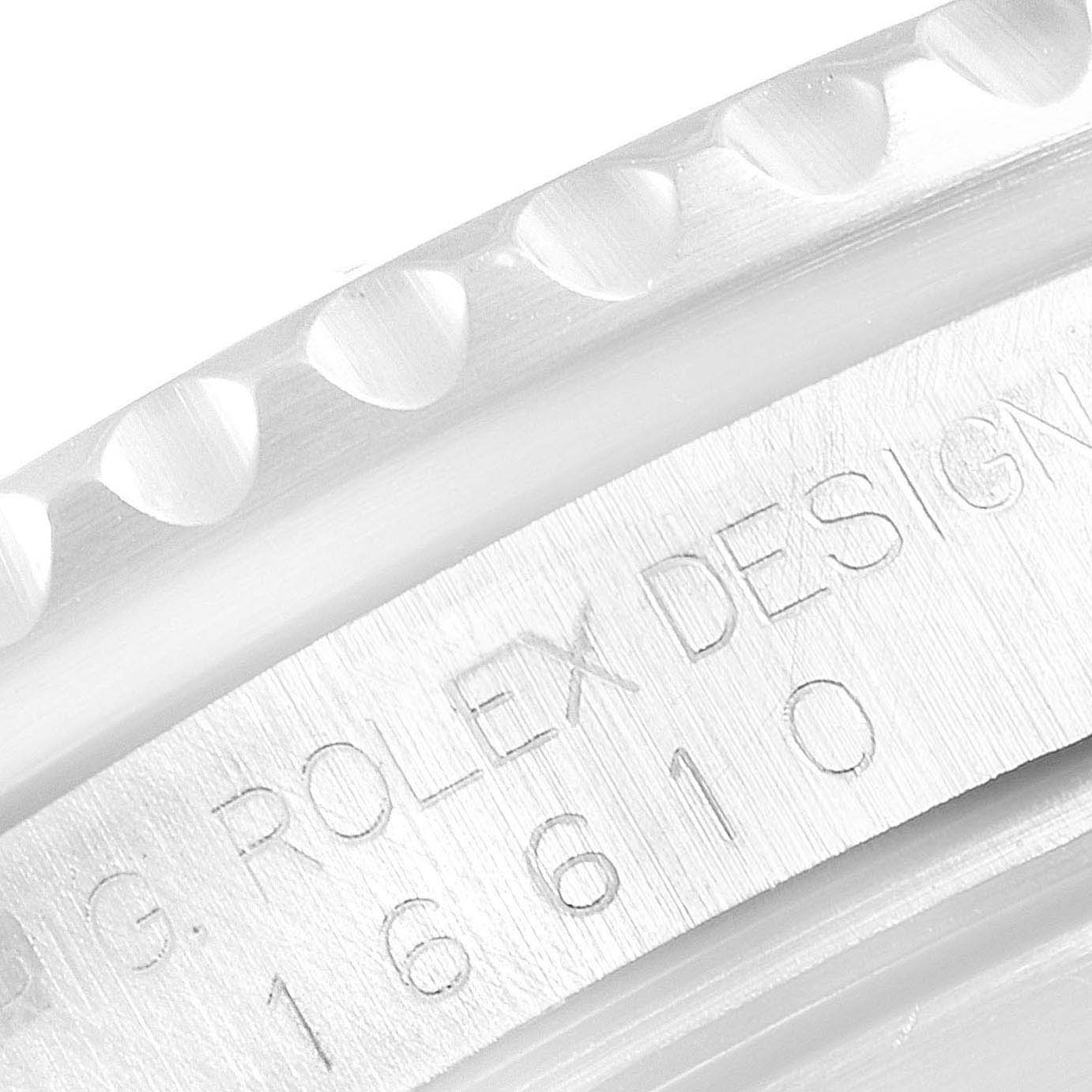 This close-up image shows the bezel and model number engraving of a Rolex Submariner 16610 Men
s Stainless Steel Black Dial 16610 Men
s Stainless Steel Black Dial watch.