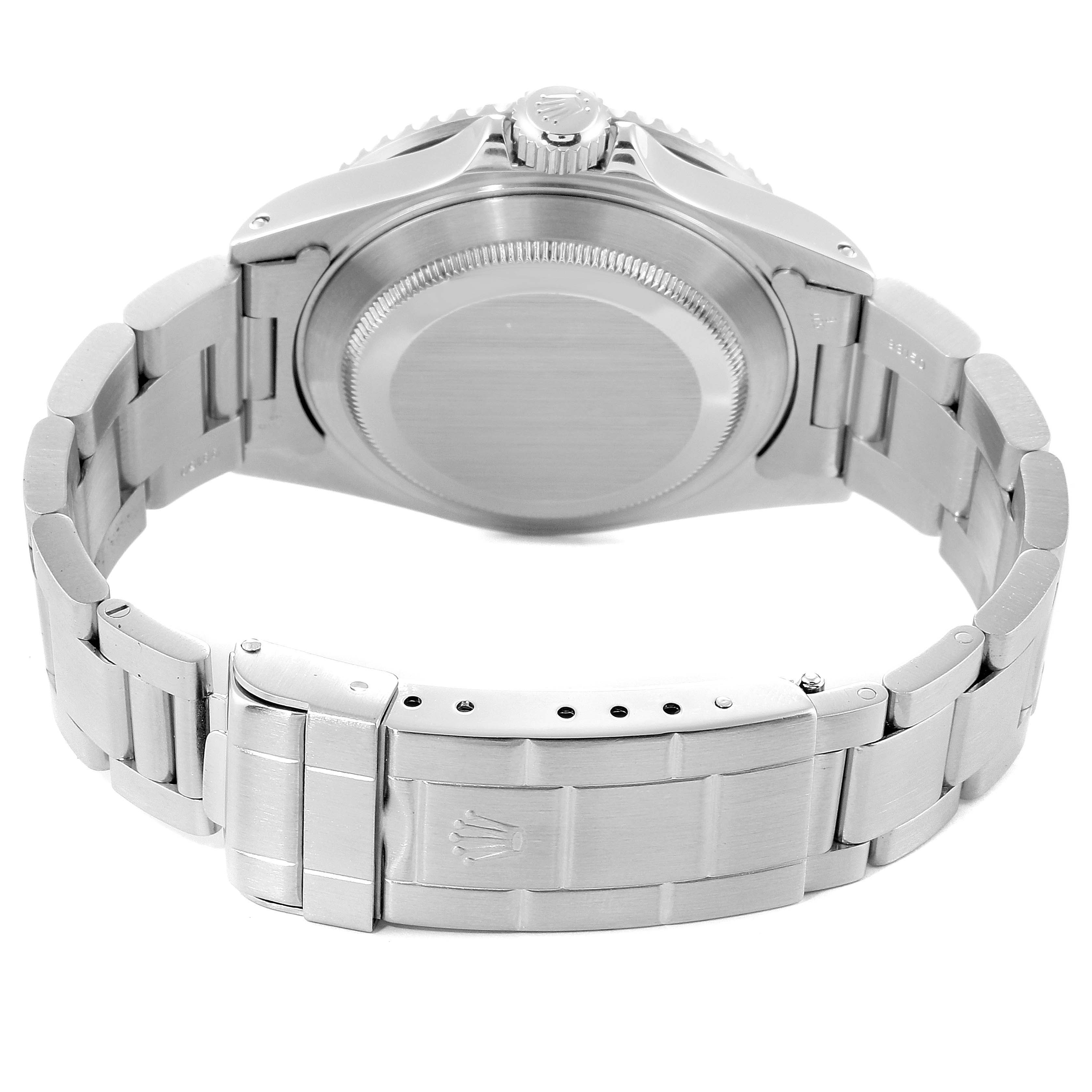 This image shows the back case, crown, and bracelet of a Rolex Submariner 16610 Men
s Stainless Steel Black Dial 16610 Men
s Stainless Steel Black Dial watch from an underside angle.