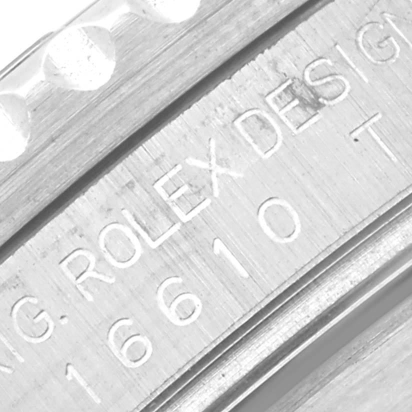 The image shows a close-up of the engraving on the case of a Rolex Submariner 16610 Men
s Stainless Steel Black Dial 16610 Men
s Stainless Steel Black Dial, highlighting the model number 16610.