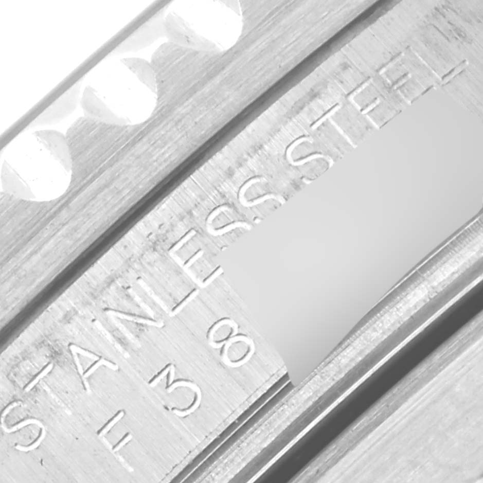 This close-up image shows the stainless steel engravings on the Rolex Submariner 16610 Men
s Stainless Steel Black Dial 16610 Men
s Stainless Steel Black Dial
s bezel and case.