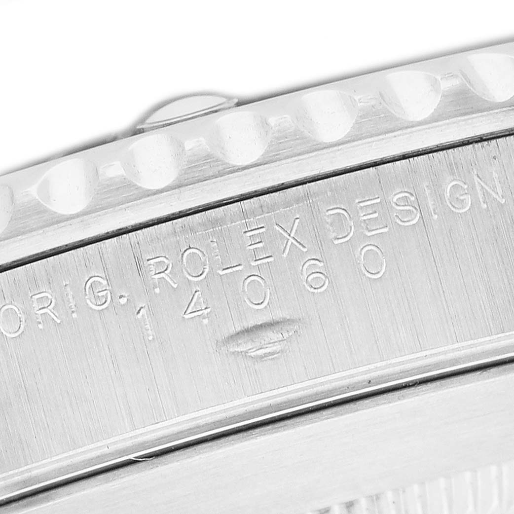 The image shows a close-up of the bezel and side engraving of a Rolex Submariner 14060 Men's Stainless Steel Black Dial, highlighting the model number 14060.