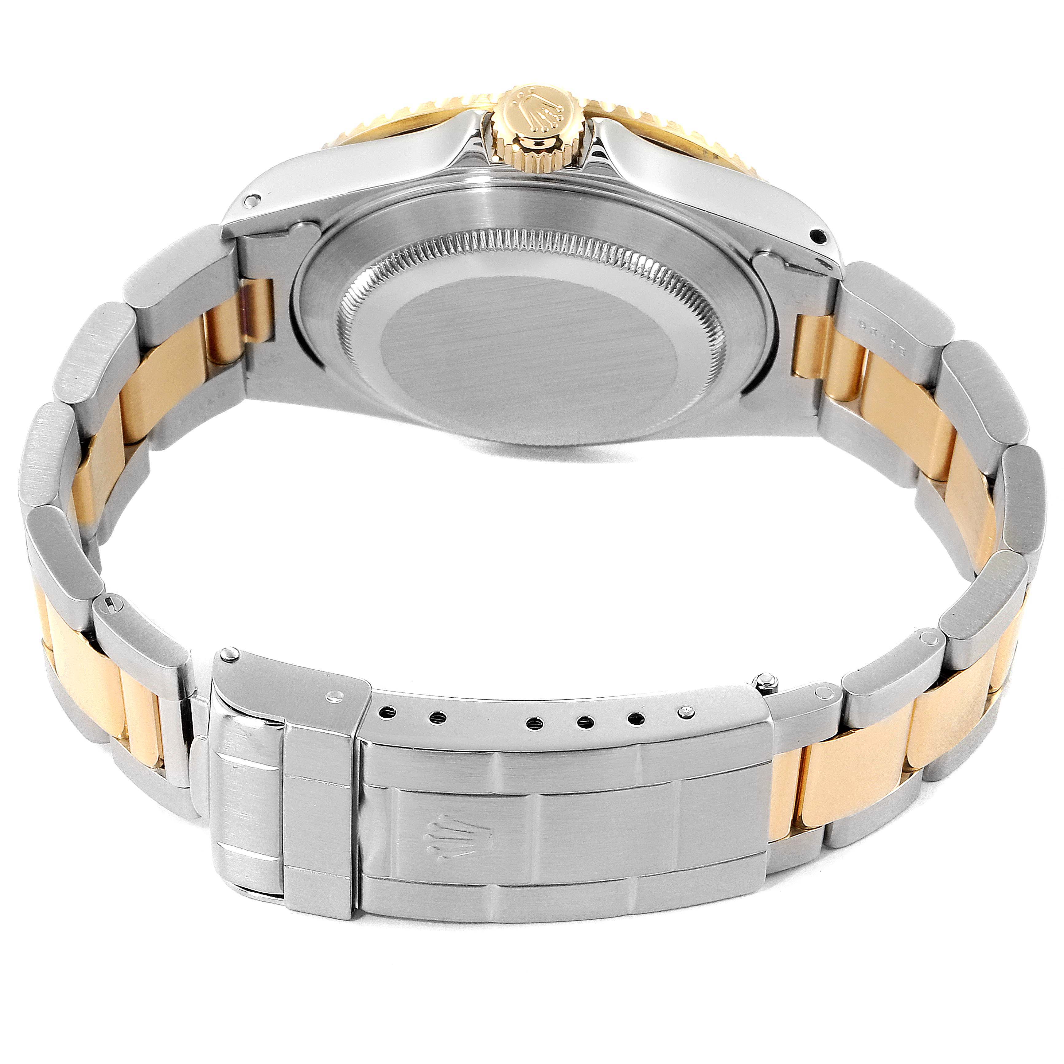 The image shows the back and clasp of the two-tone bracelet of a Rolex Submariner 16613 Men
s Steel and Gold (two tone) Champagne Dial 16613 Men
s Steel and Gold (two tone) Champagne Dial watch.