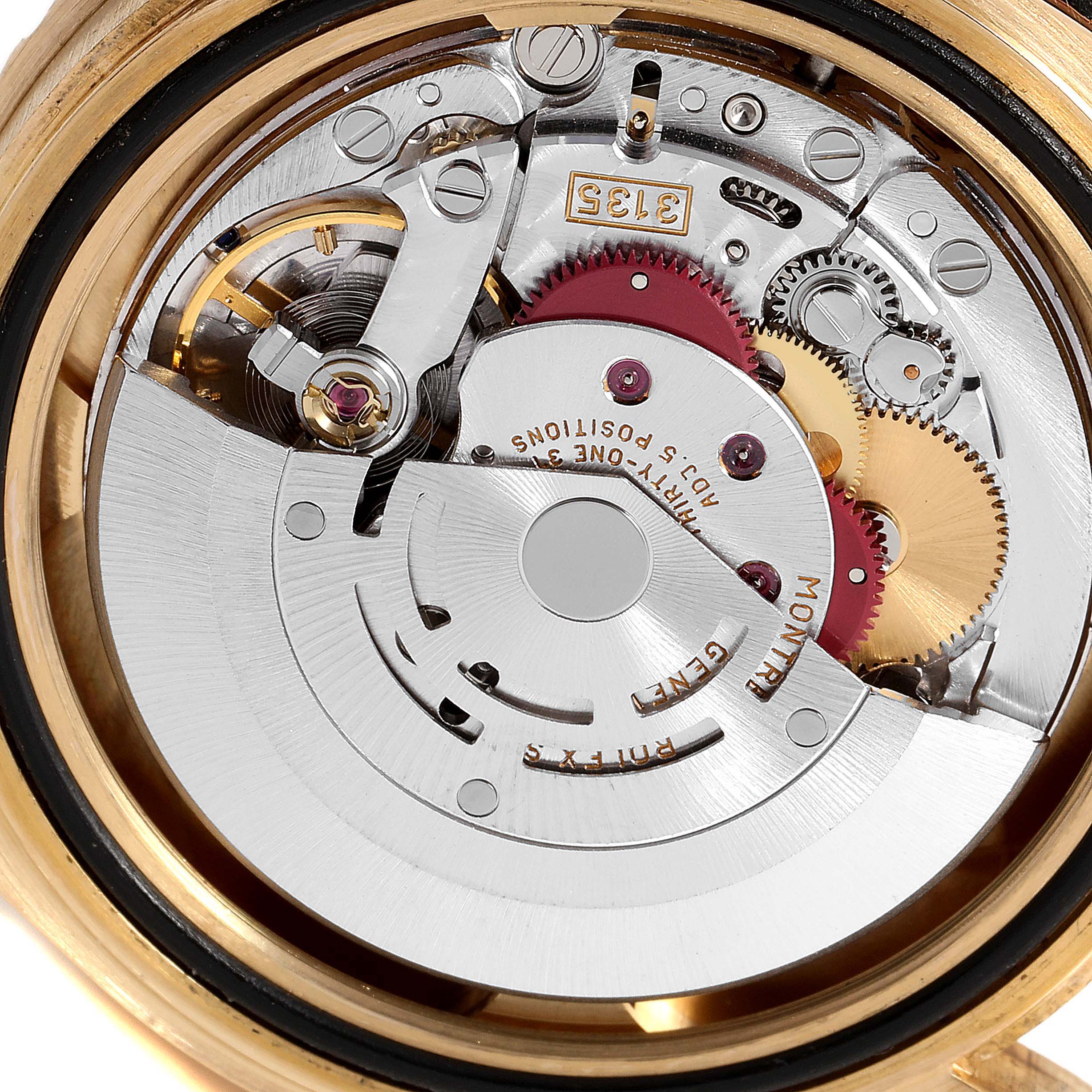 The image shows the internal mechanism of a Rolex Submariner 16618 Men's Yellow Gold Blue Dial 16618 Men's Yellow Gold Blue Dial watch from a rear angle.