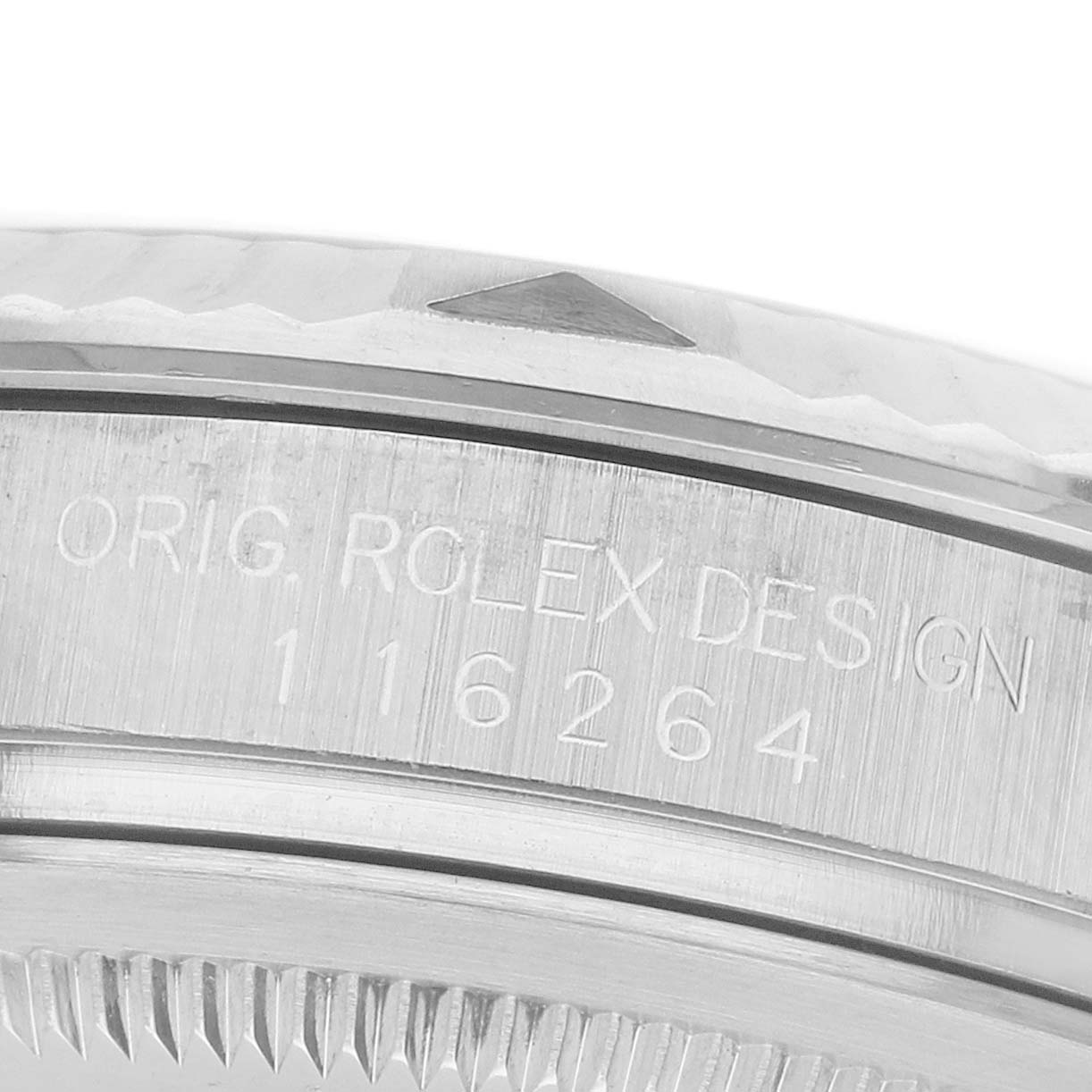 The image shows a close-up of the bezel and side engraving of a Rolex Turn-o-Graph 116264 Men's Stainless Steel Black Dial watch.