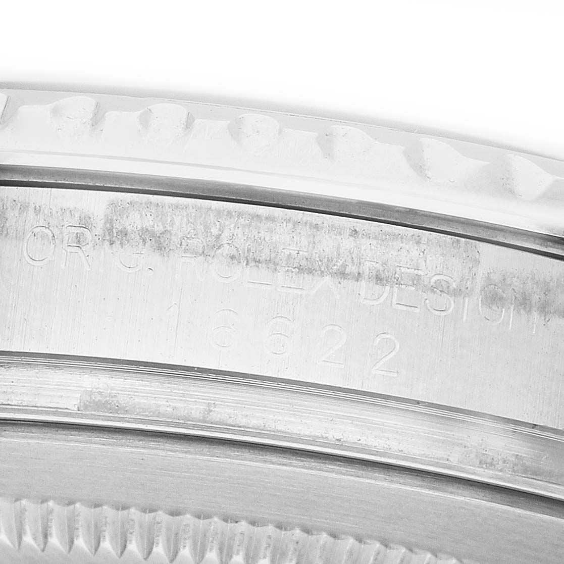 The image shows a close-up of the side engraving and bezel edge of the Rolex Yacht-Master 16622 Men's Stainless Steel Silver Dial watch.