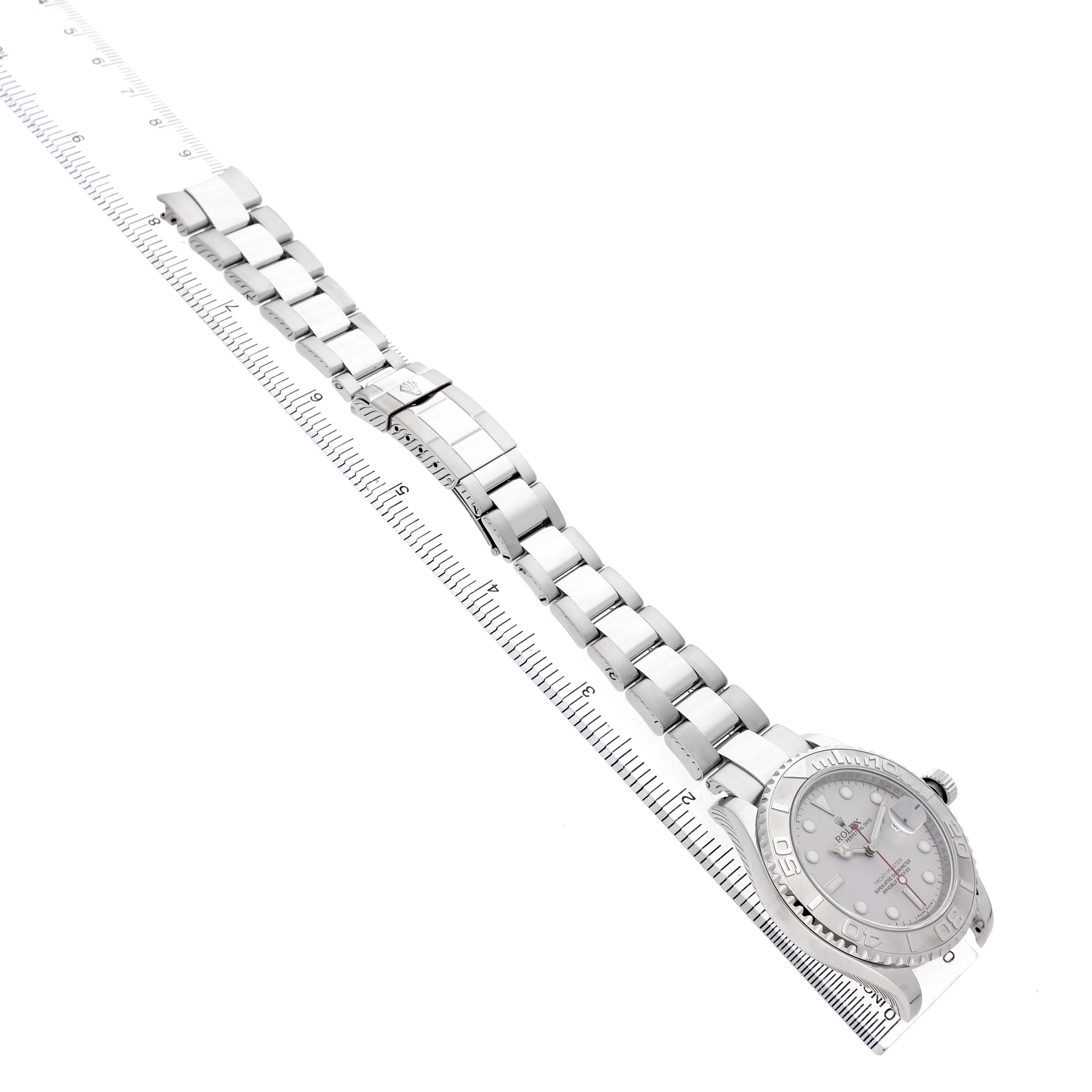 The Rolex Yacht-Master 16622 Men's Stainless Steel Silver Dial watch is shown at an angle, displaying the full bracelet, clasp, and the watch face partially.