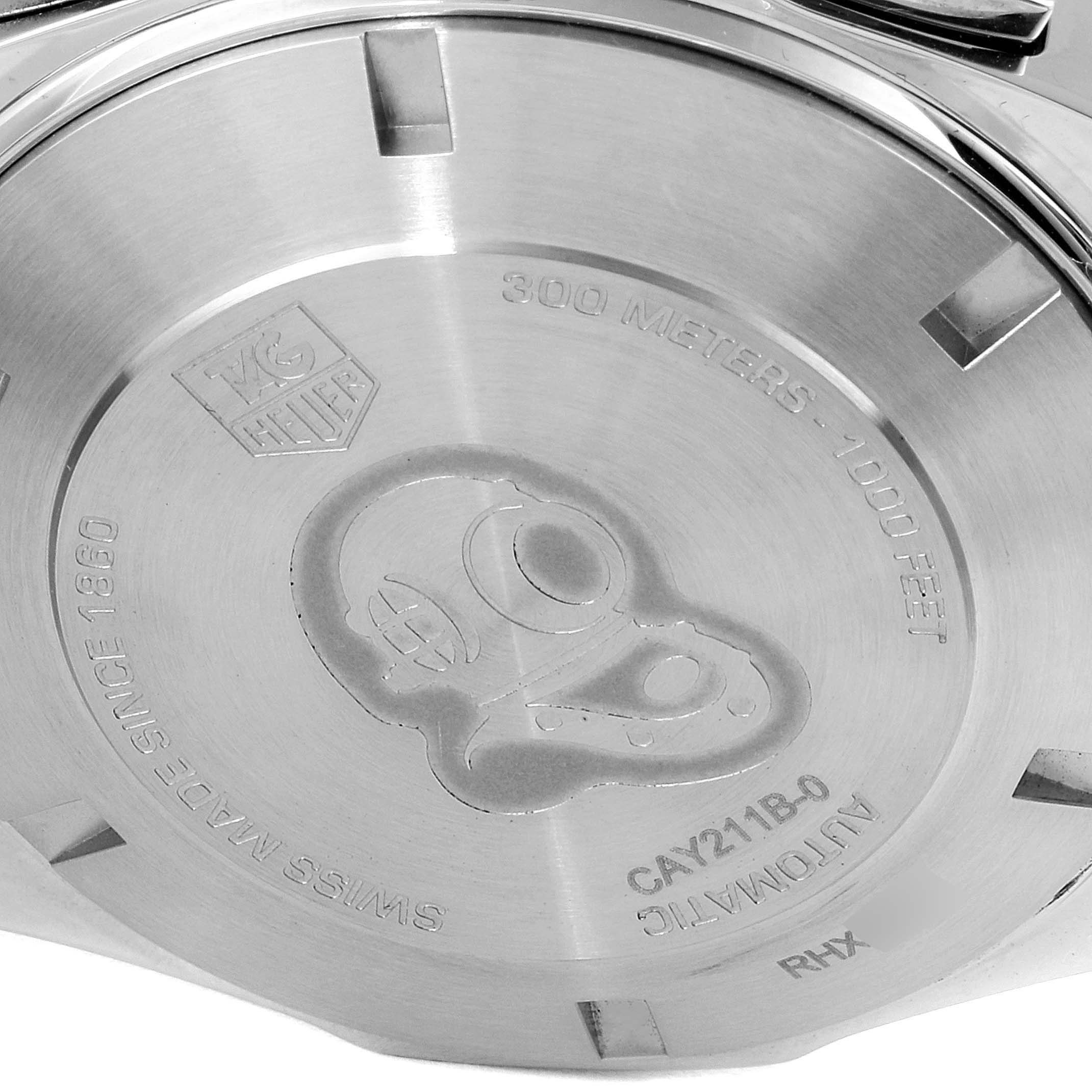 This image shows the case back of the Tag Heuer Aquaracer CAY211B.BA0927 Men
s Stainless Steel Blue Dial CAY211B.BA0927 Men
s Stainless Steel Blue Dial watch with engravings and model information.