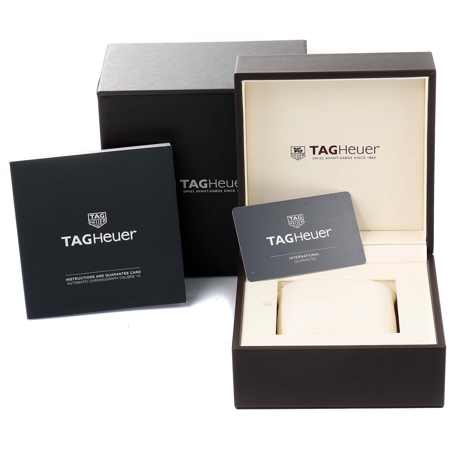 This image shows the packaging, warranty card, and instruction manual for the Tag Heuer Aquaracer CAY211B.BA0927 Men
s Stainless Steel Blue Dial CAY211B.BA0927 Men
s Stainless Steel Blue Dial watch.