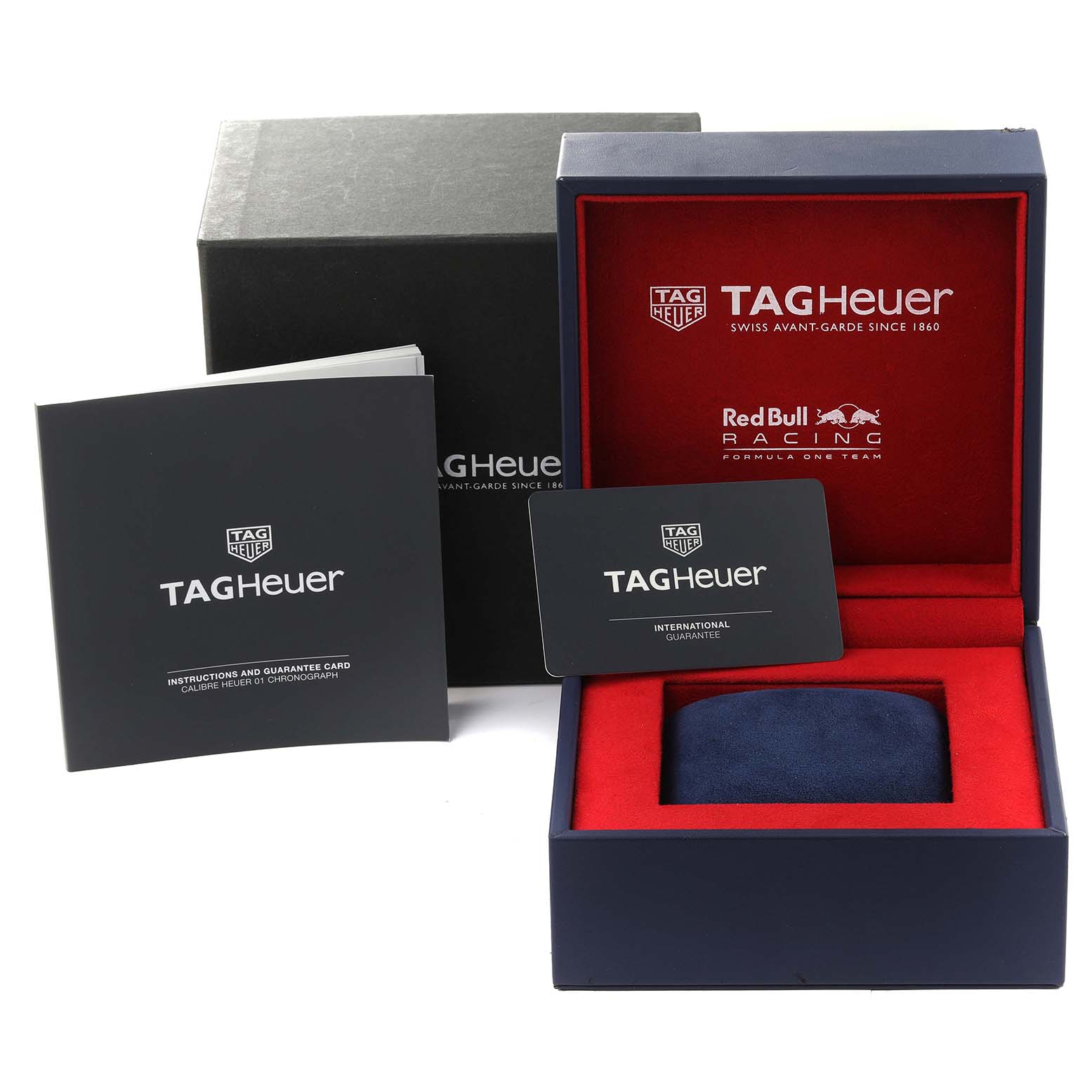 The image shows a Tag Heuer Carrera CAR2A1N.FT6100 Men's Stainless Steel Blue Dial CAR2A1N.FT6100 Men's Stainless Steel Blue Dial box, guarantee card, and instructions, displayed from a frontal angle.