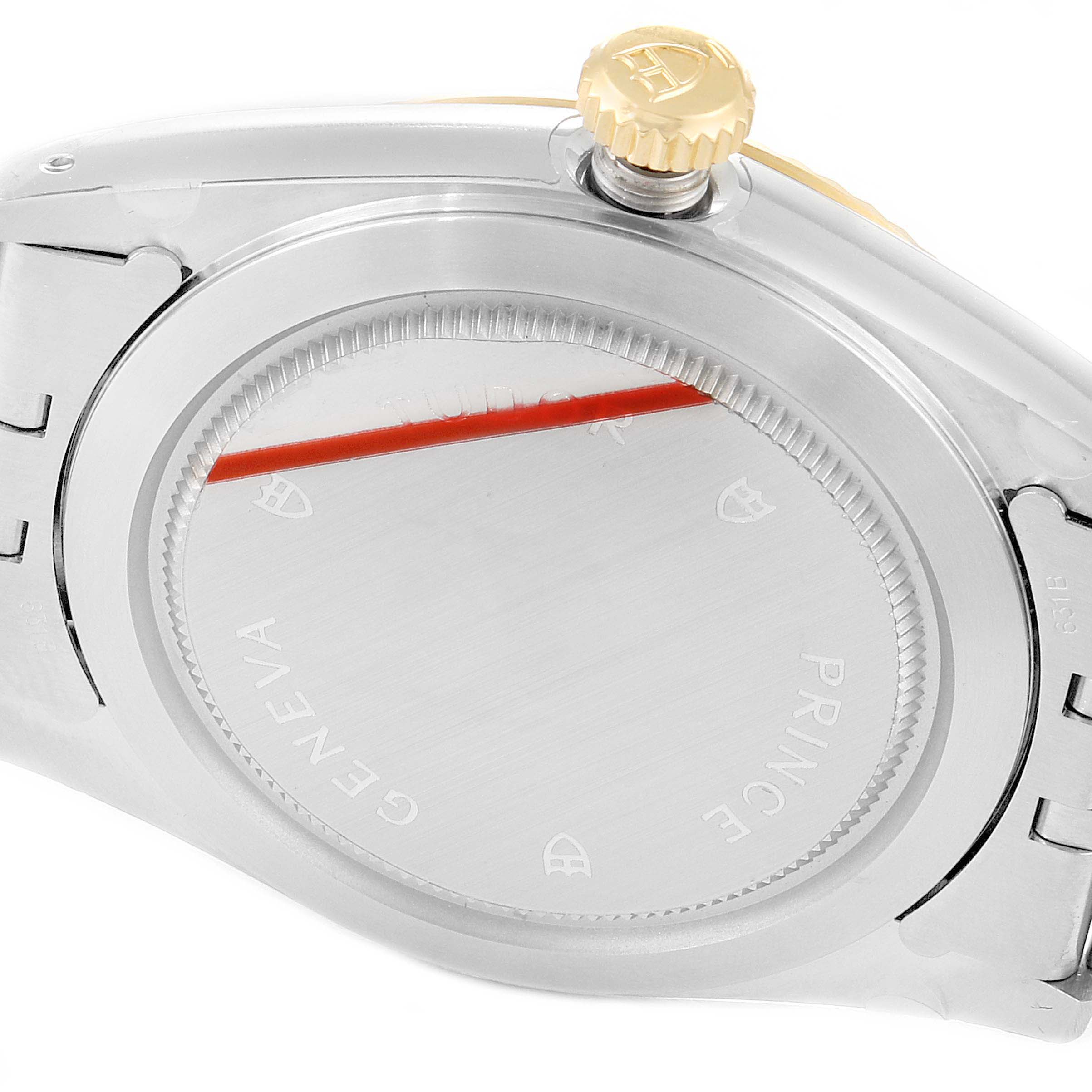 The image shows the case back and crown of a Tudor Prince 76213 Men
s Steel and Gold (two tone) Silver Dial 76213 Men
s Steel and Gold (two tone) Silver Dial watch at an oblique angle.